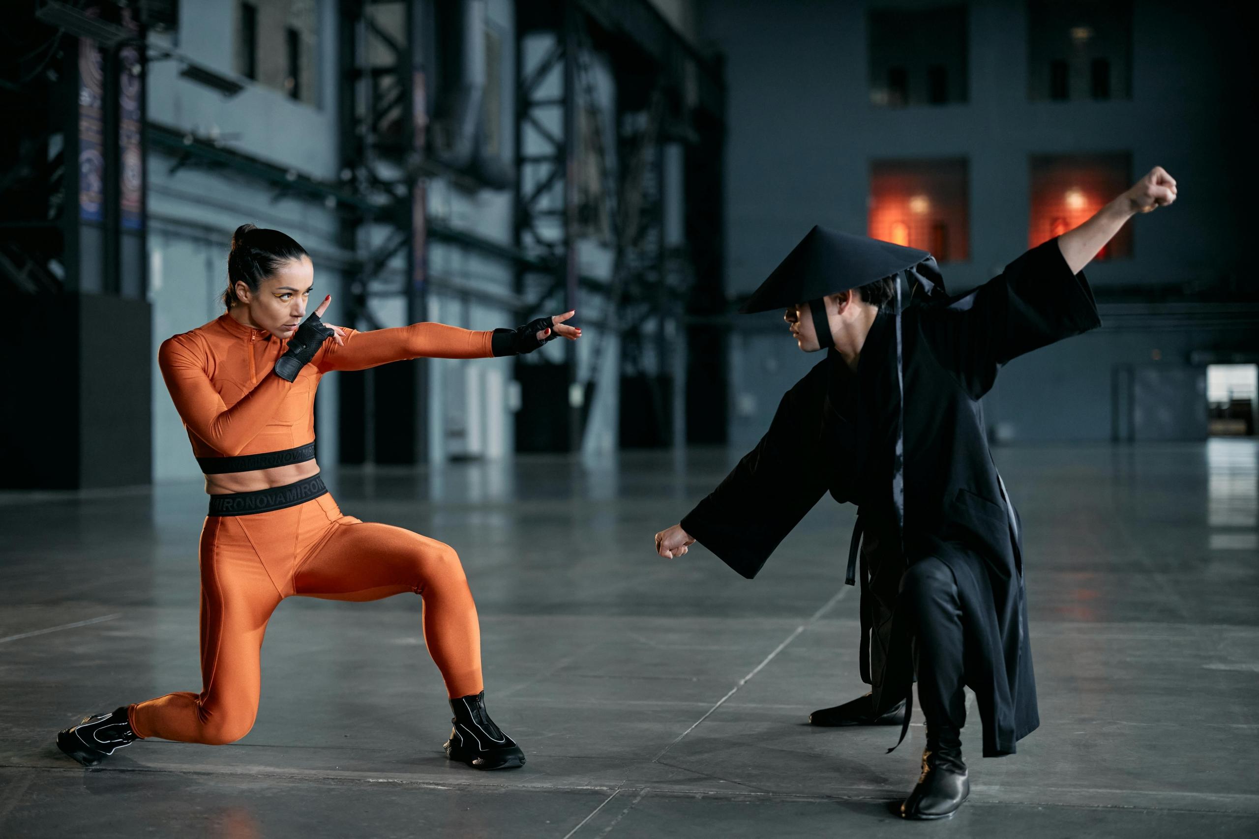 Two actors engaging in combat for a martial arts action movie.