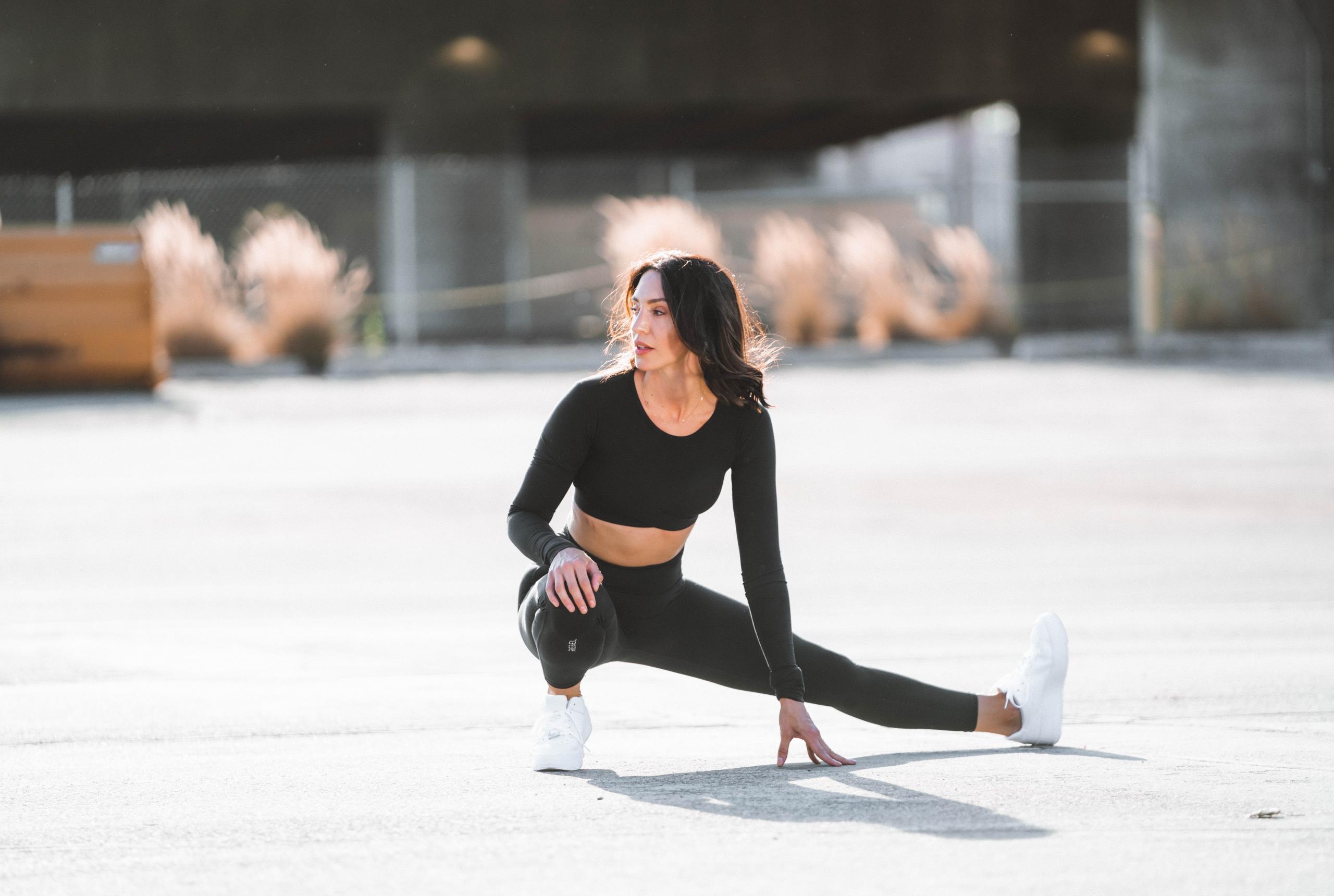 Woman doing stretches in outdoor space