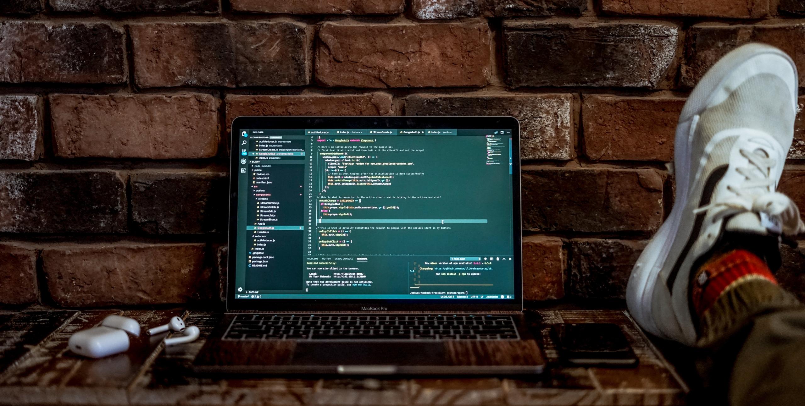 Code being written on a laptop