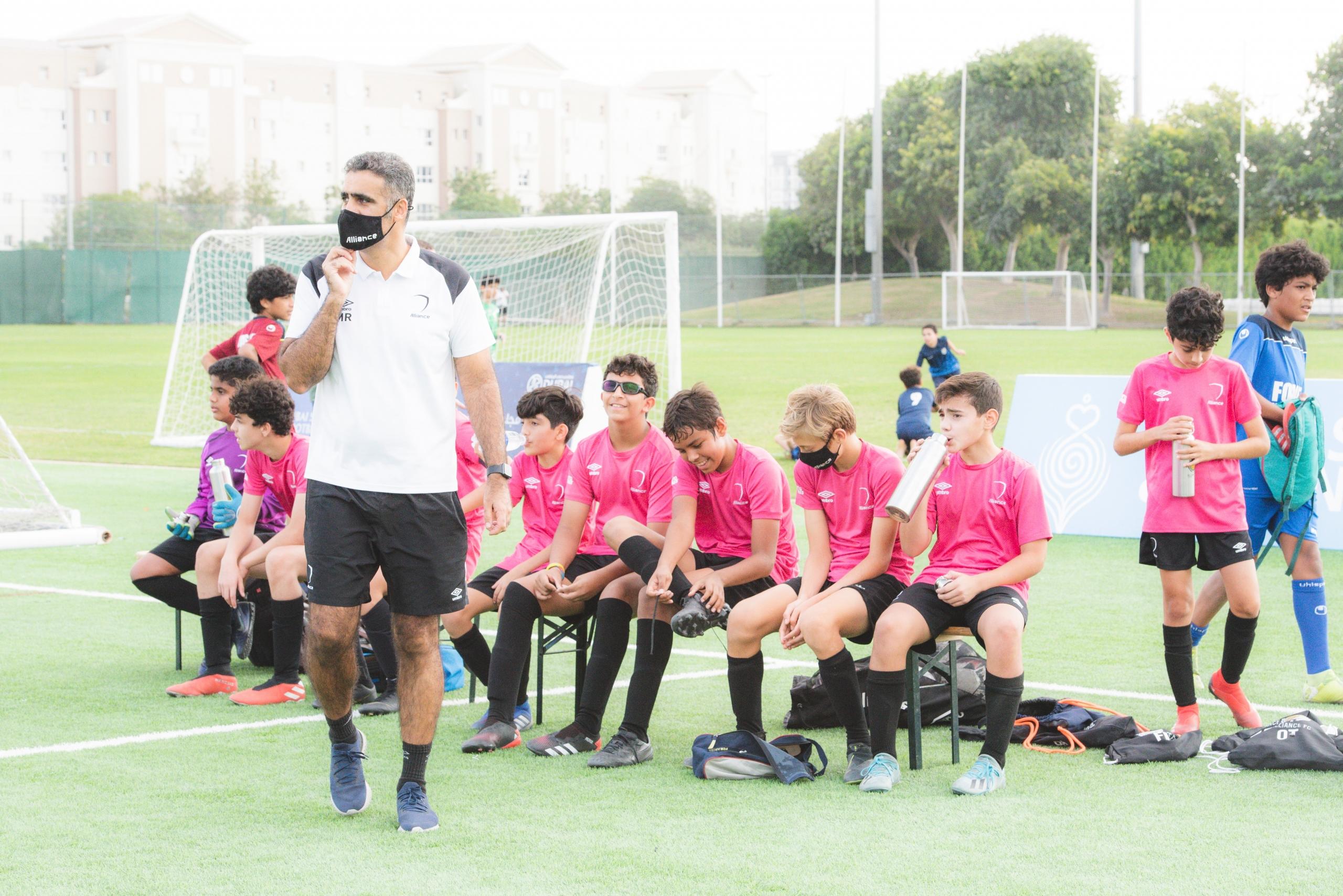 Football coach with their team