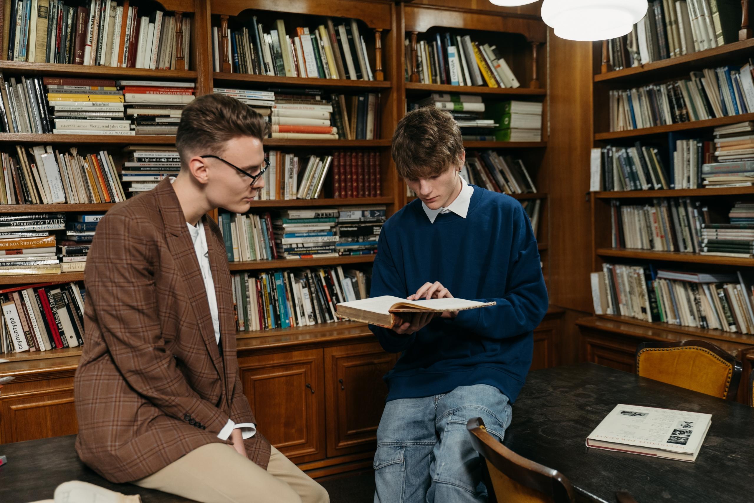 Two students reading Irish poetry