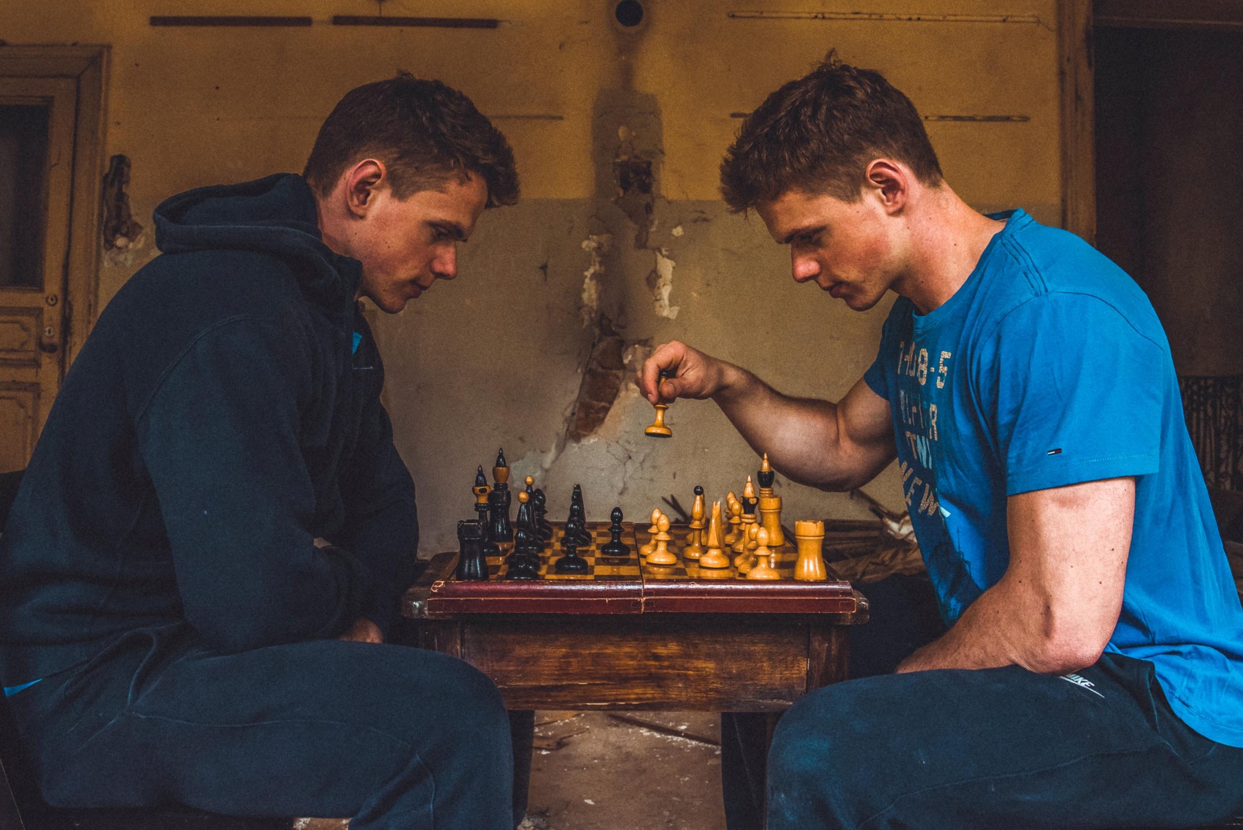 Chess players considering the next move