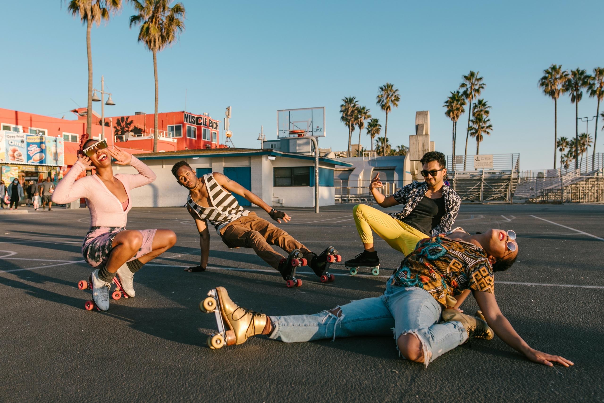 Group of friends showing roller skating skills
