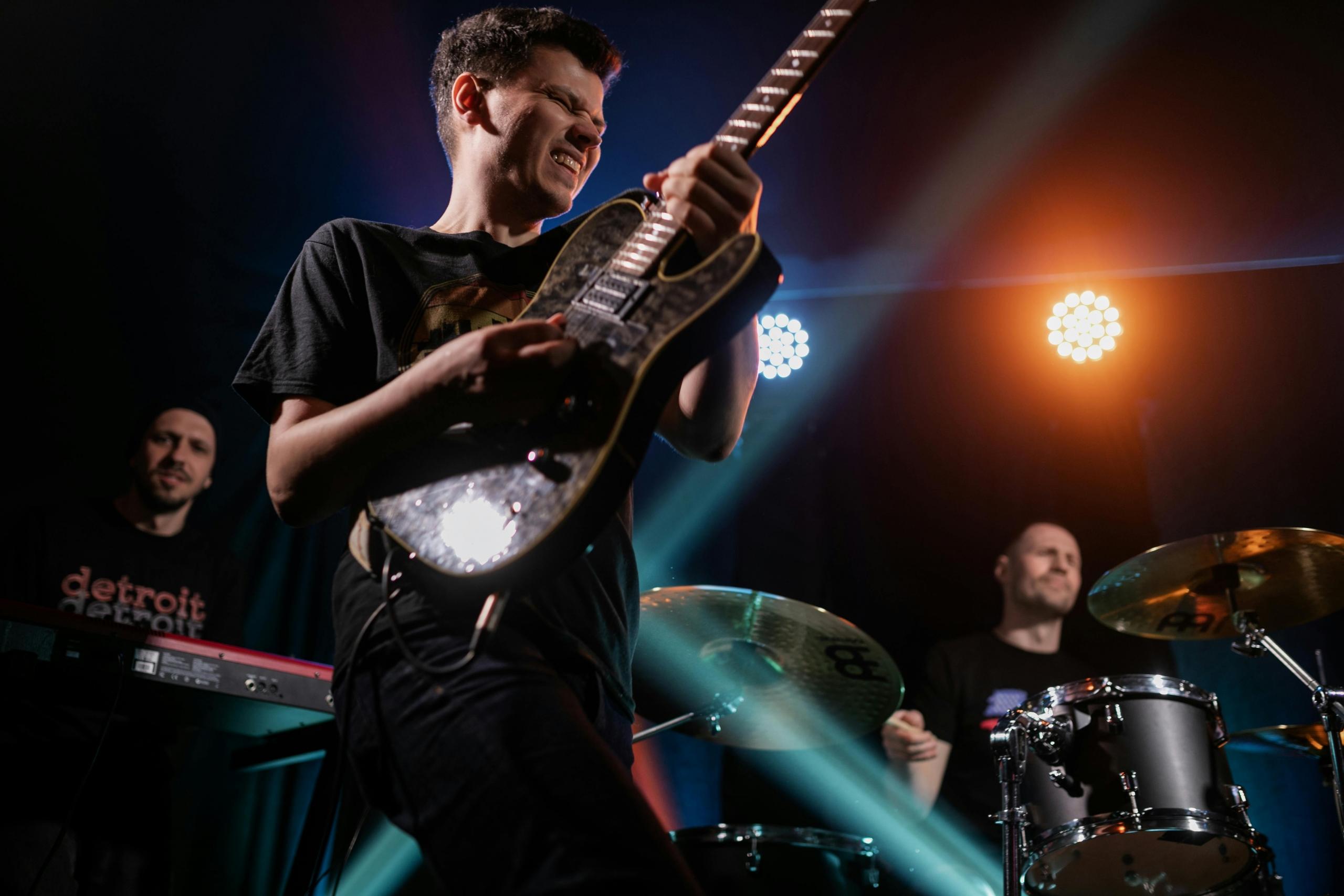 A rock star performing in front of his fans on stage