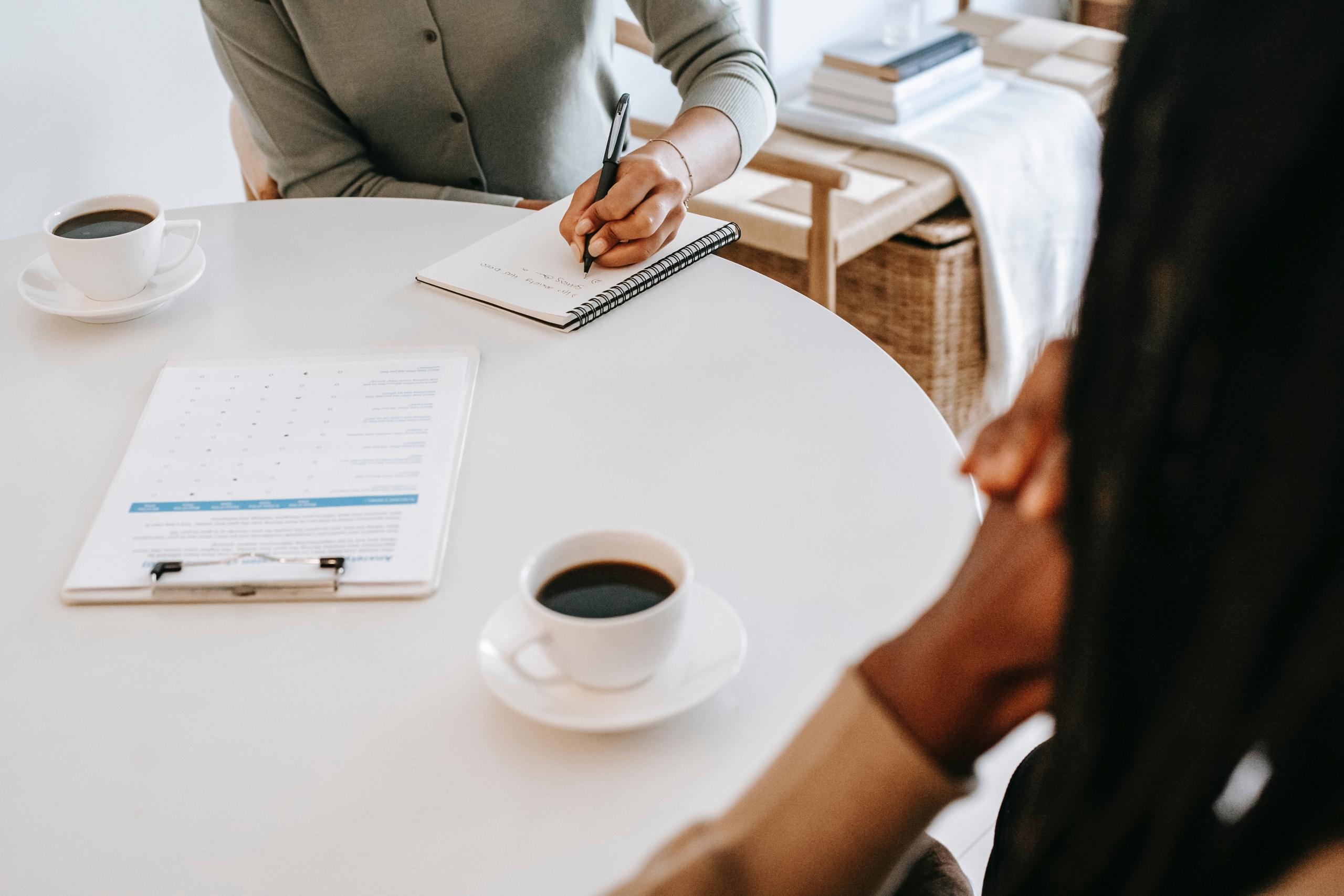 Patient sharing thoughts with an attentive psychologist in a therapy room.