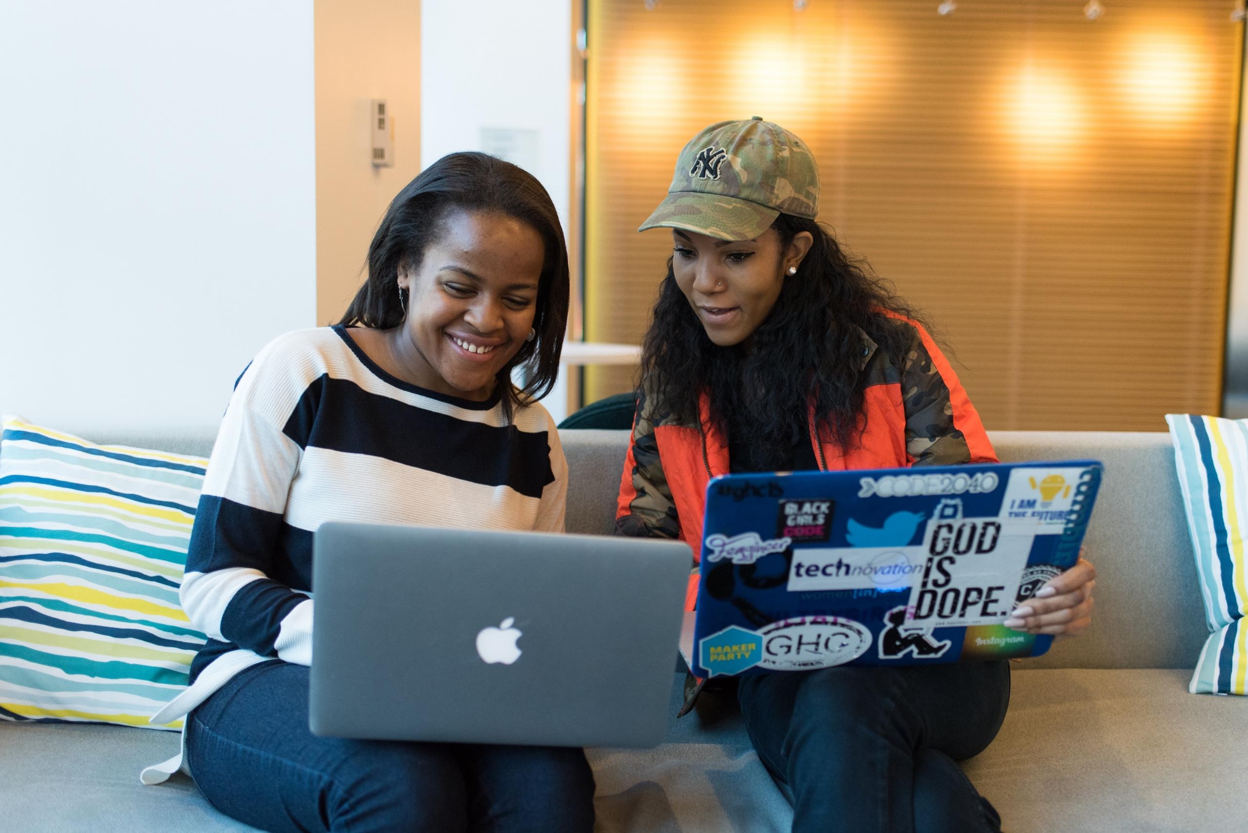 Devoted coder collaborating with peers, fostering teamwork in the tech world.
