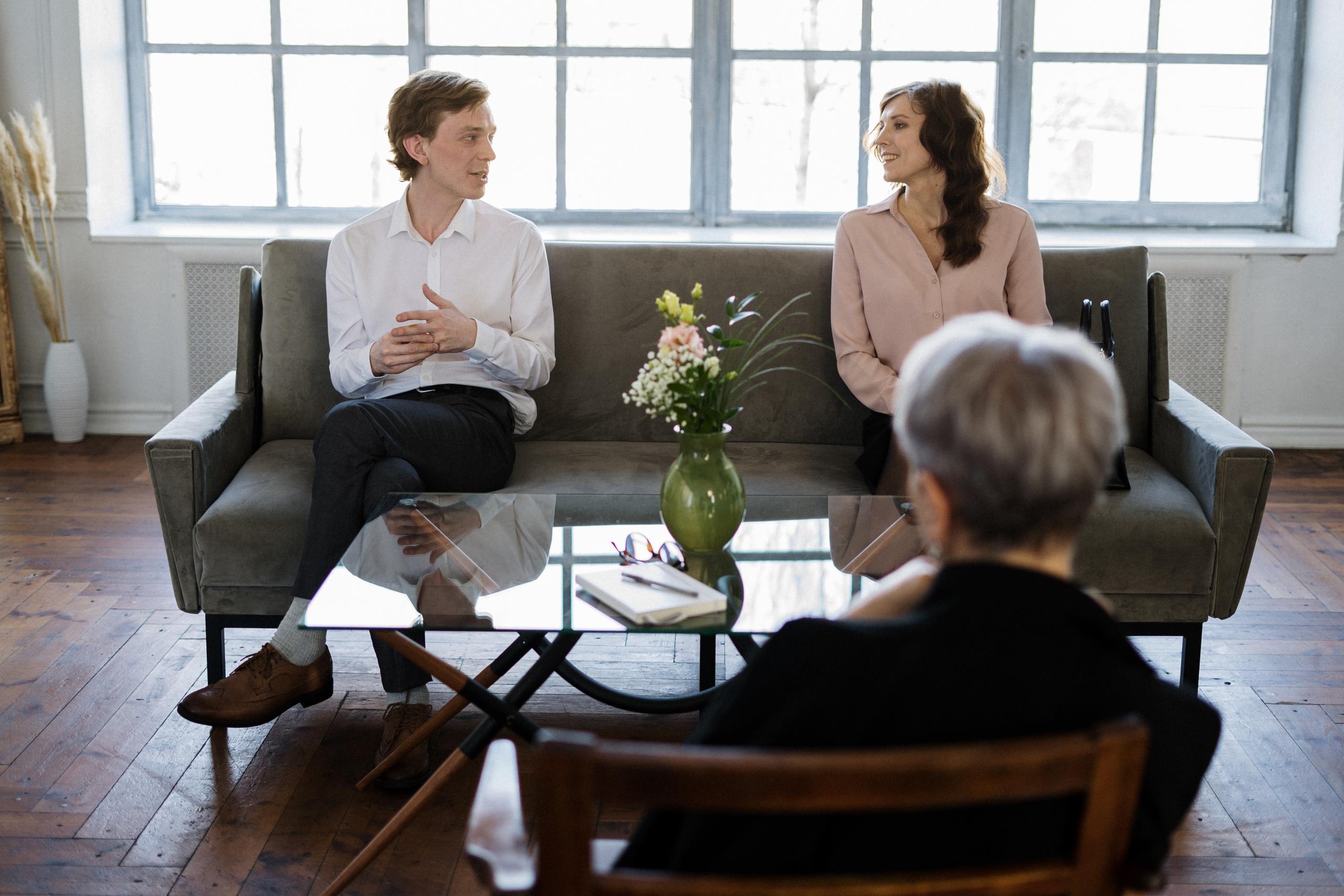 Psychologist engaged in a counselling session with a focused patient.
