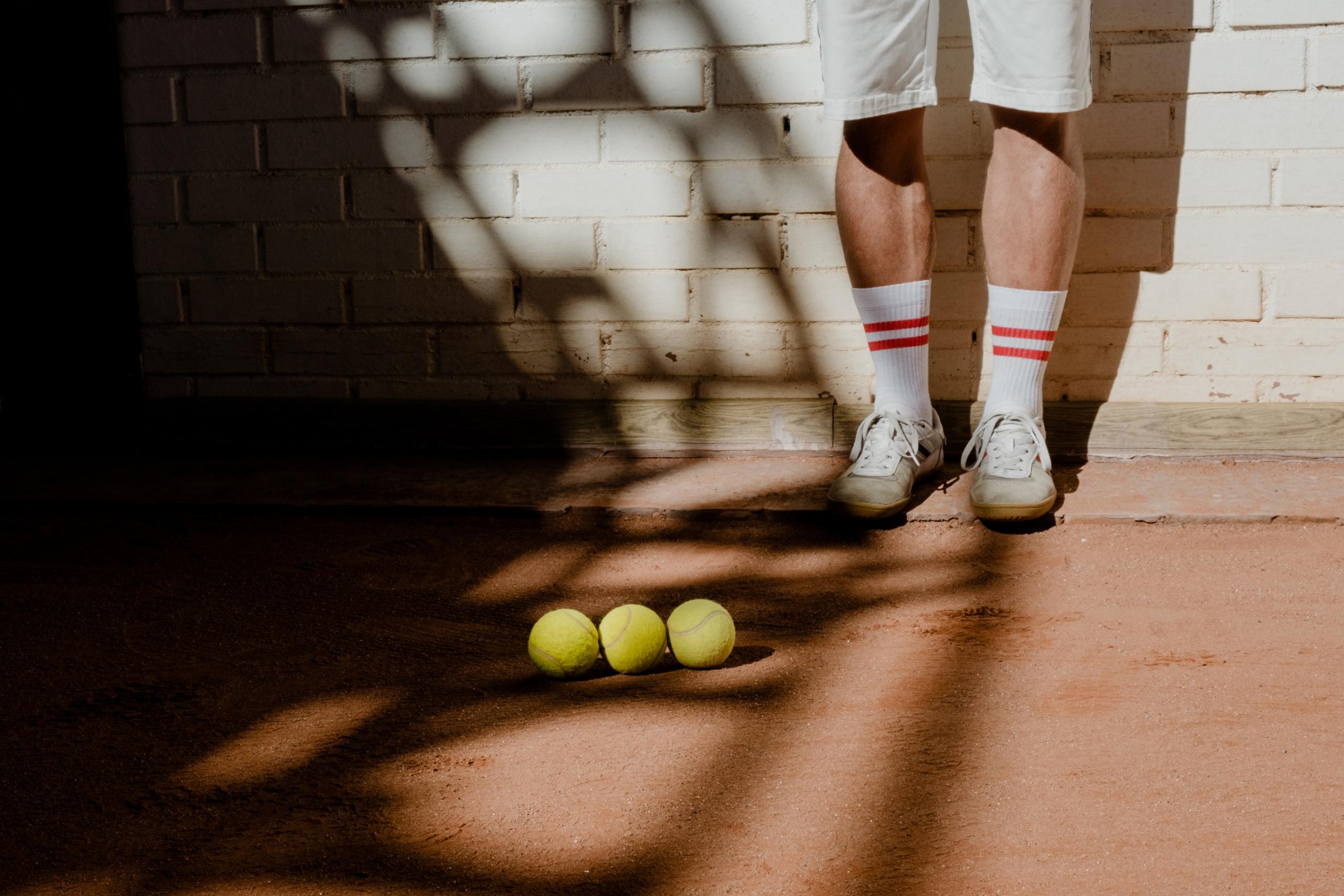 Tennis racket held confidently by a player, capturing the intensity of a match.