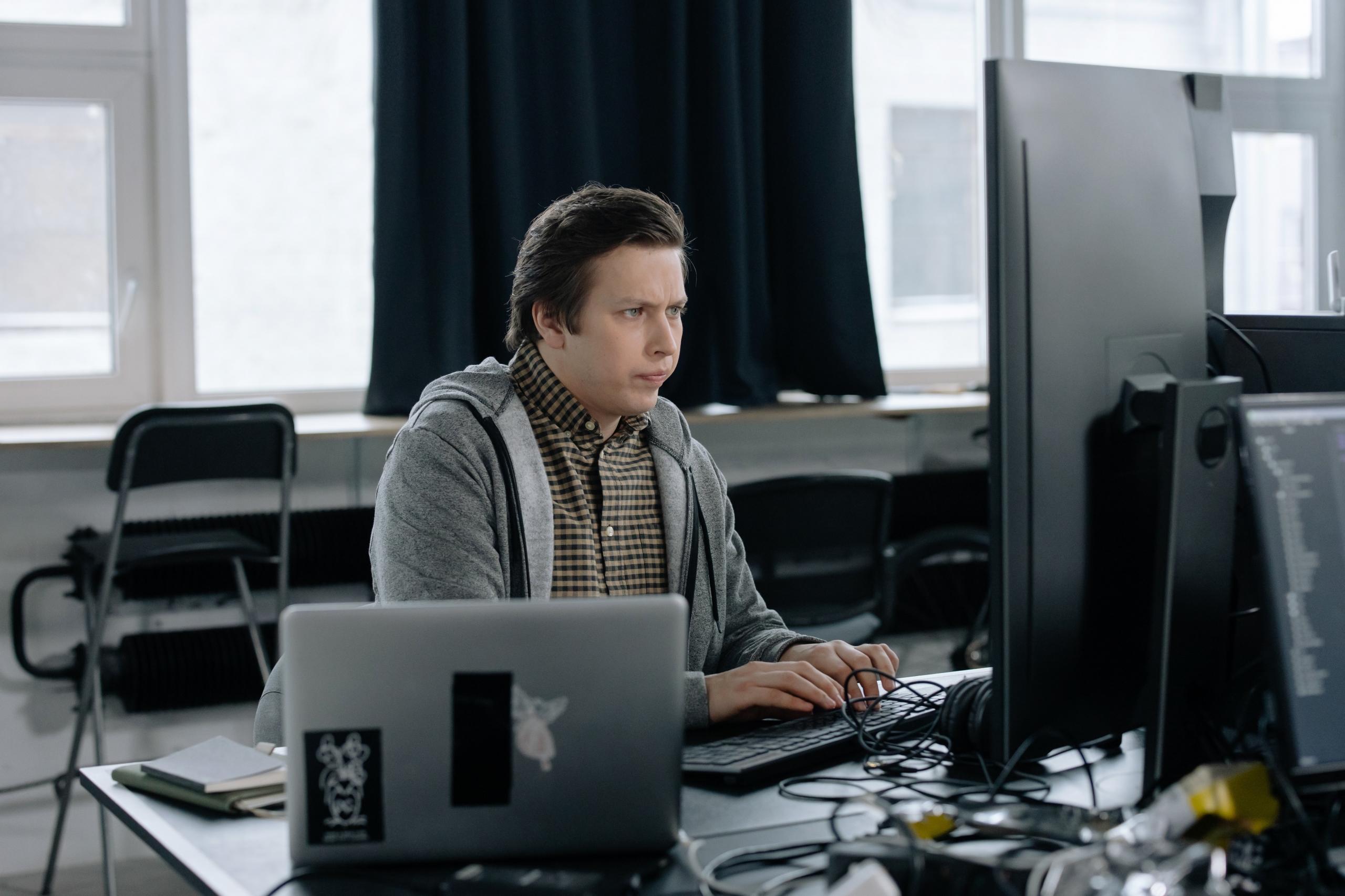 Tech-savvy coder in action, crafting software that drives the future.
