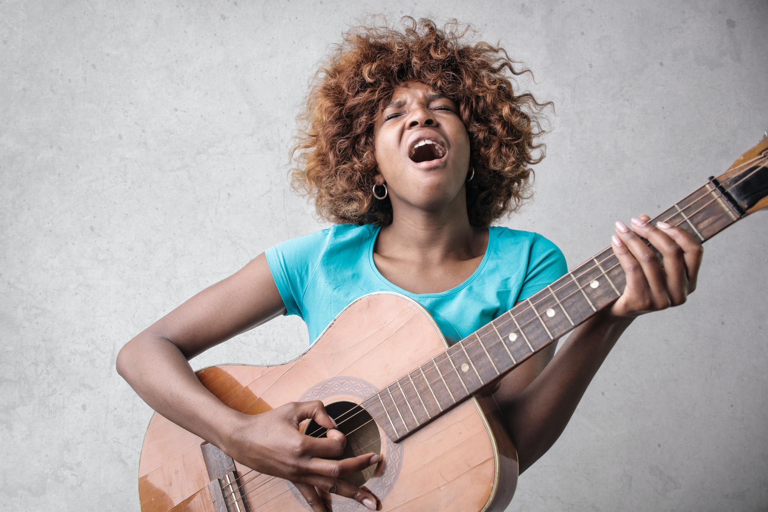 A passionate singer belting out a heartfelt melody.