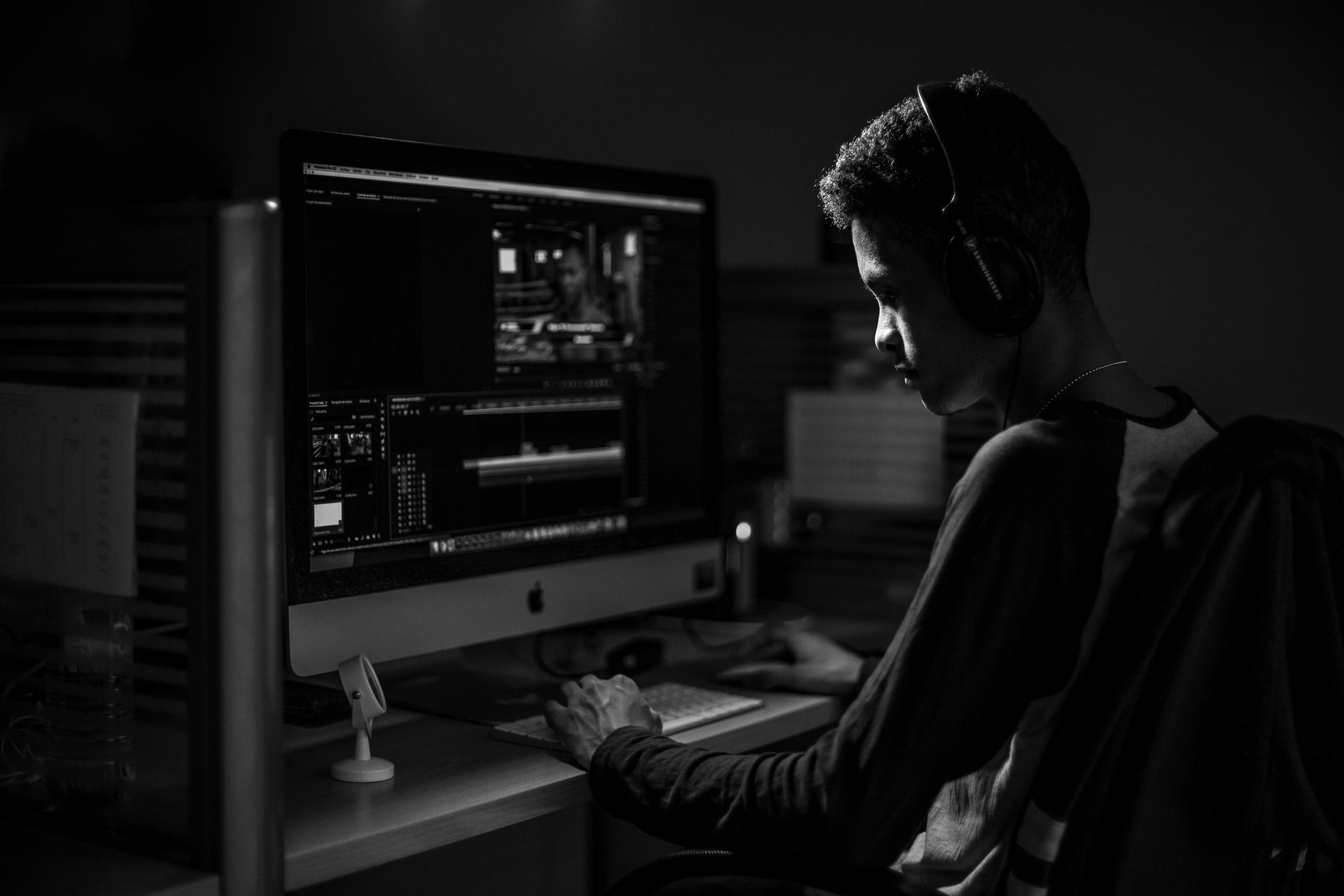 A programmer working hard writing lines of code.