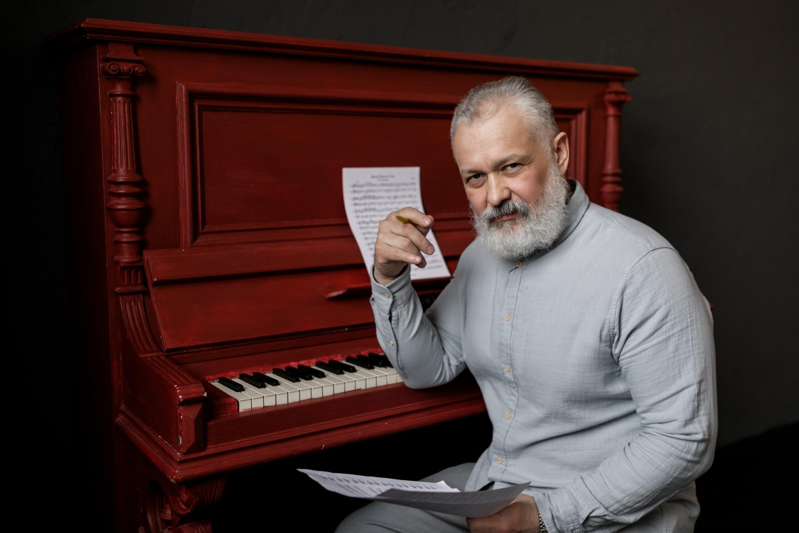 A music tutor preparing for a private session.