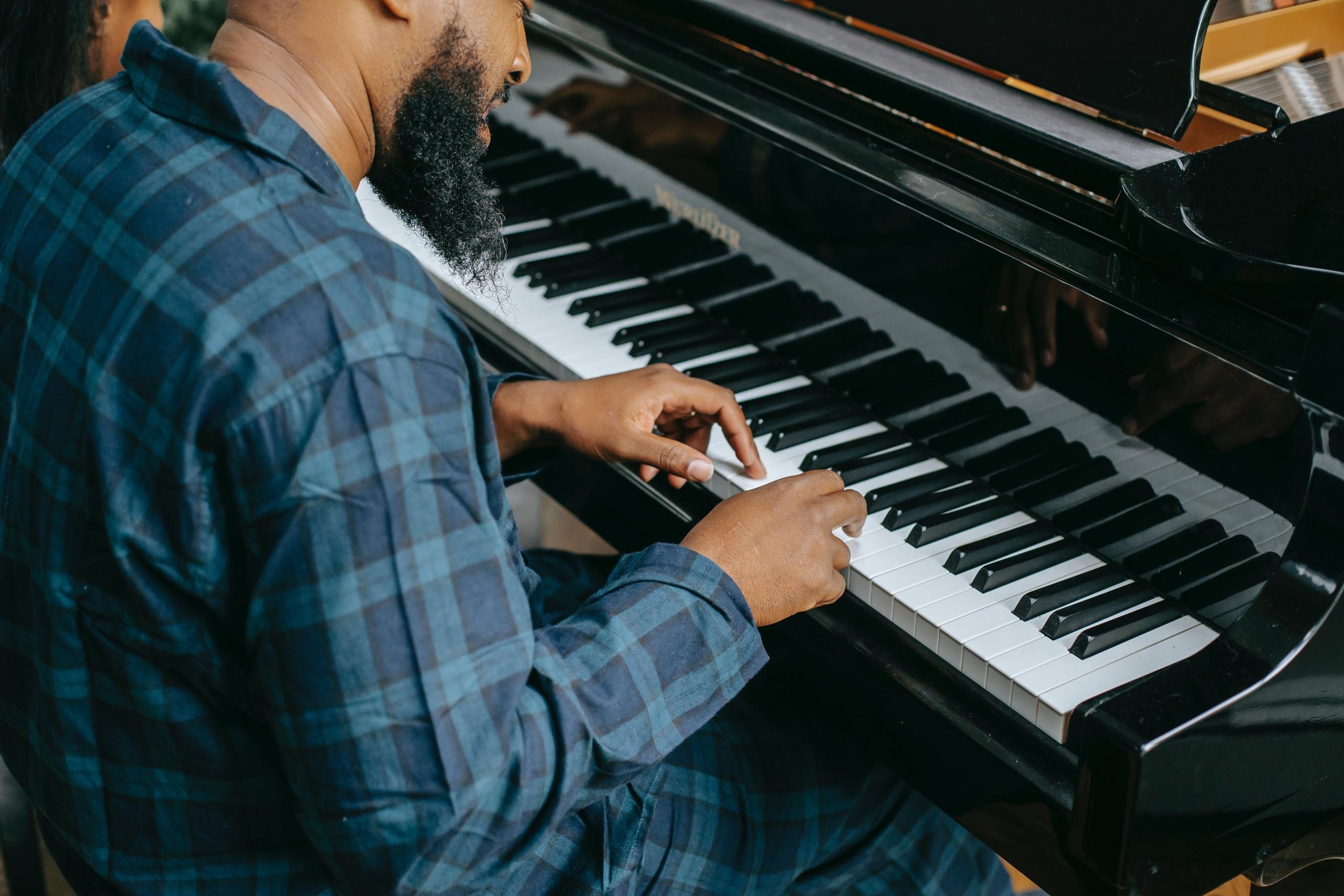 Man playing piano at home