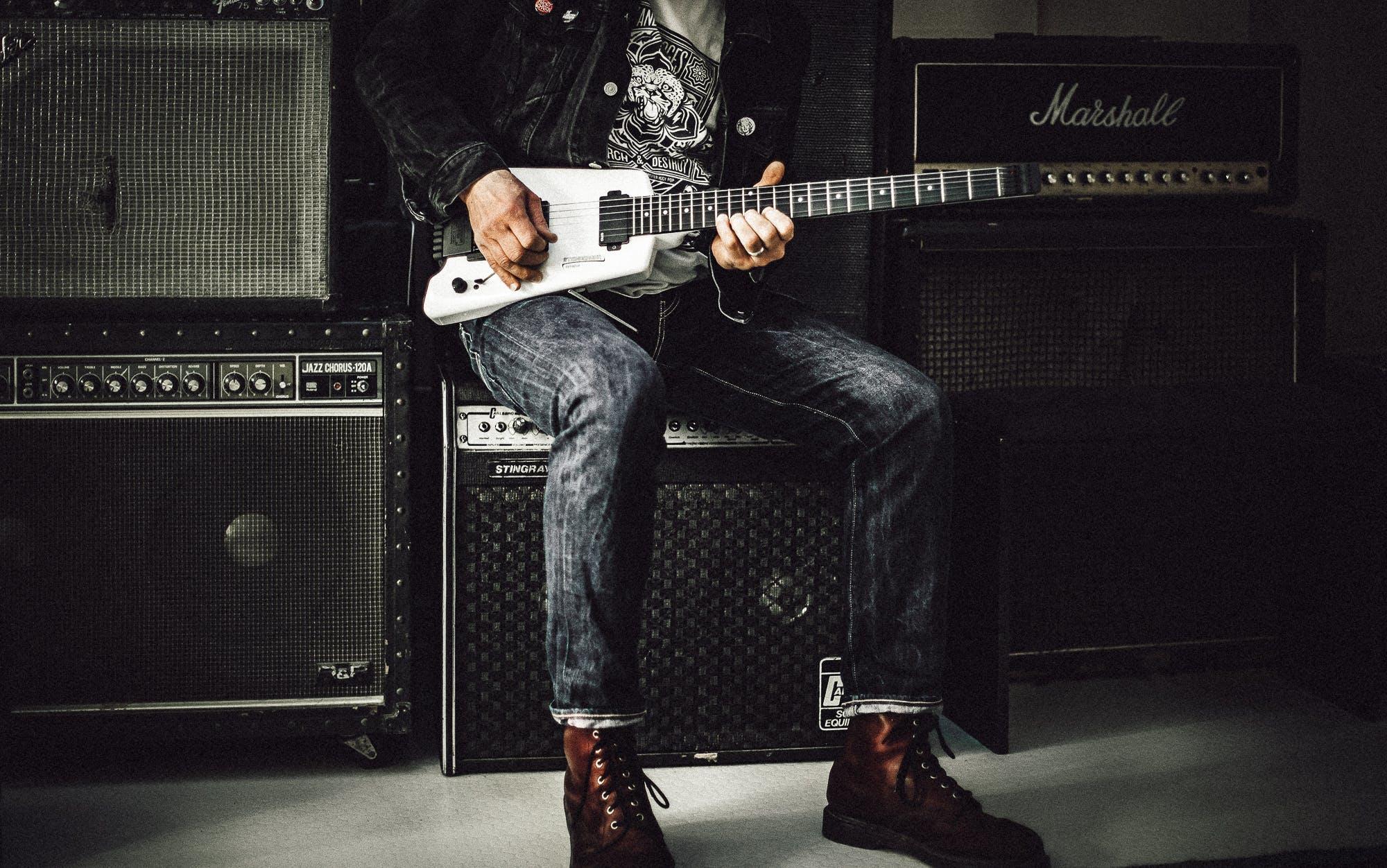A student splaying the guitar.