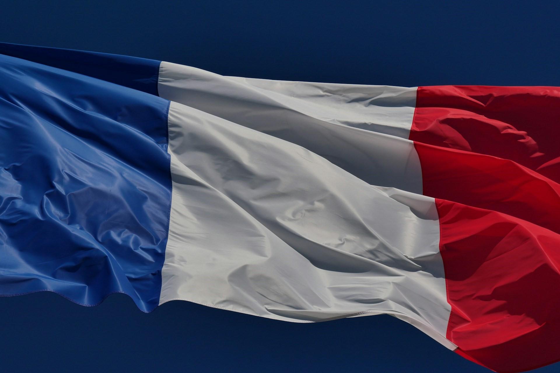 The French flag waving in the wind.
