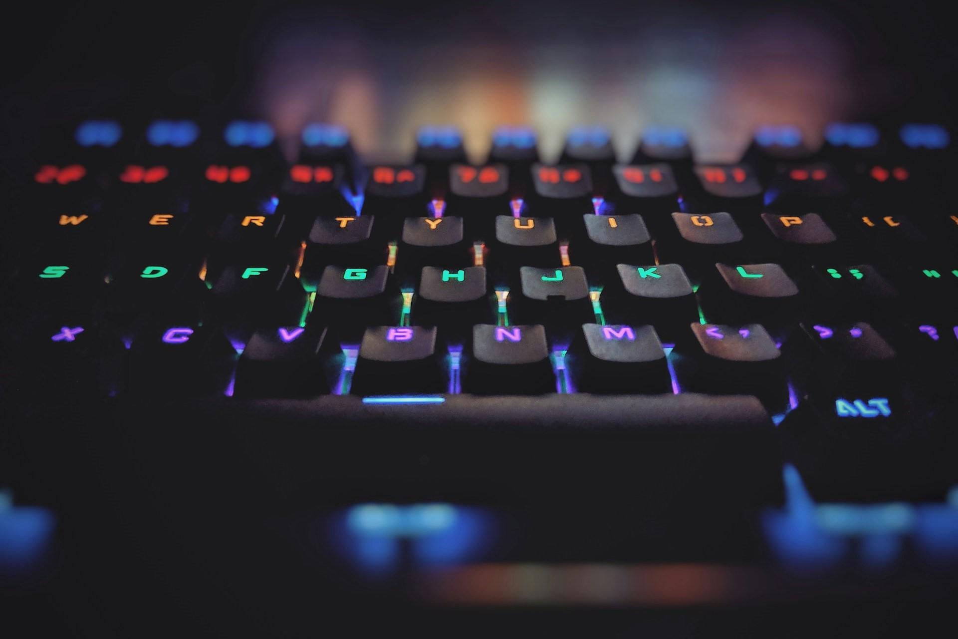 A closeup of a keyboard with multicoloured keys.