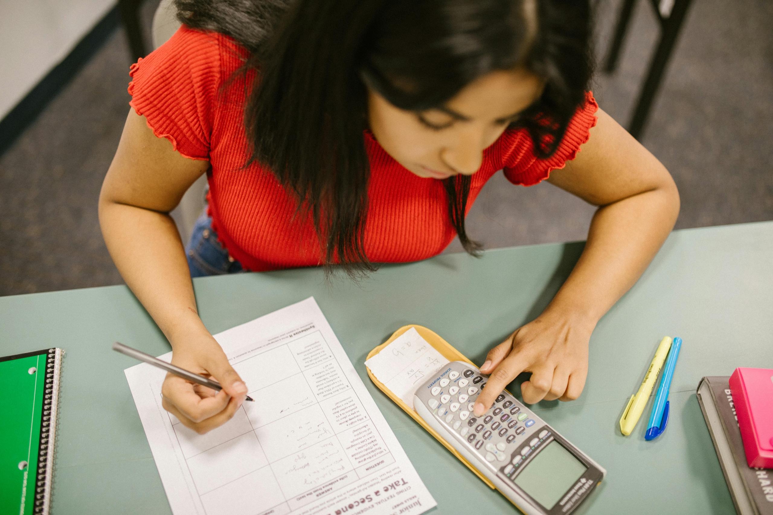A maths student practising exam papers to get used to the format of the paper.