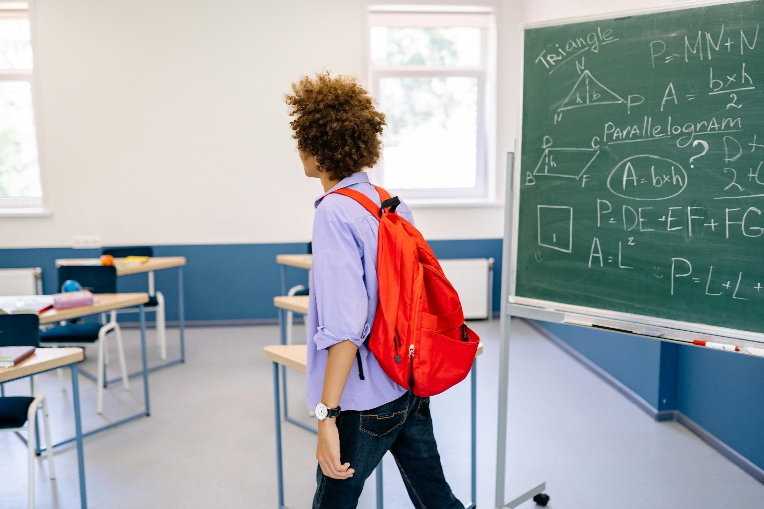 A student walking into class to prepare for their leaving cert exams.