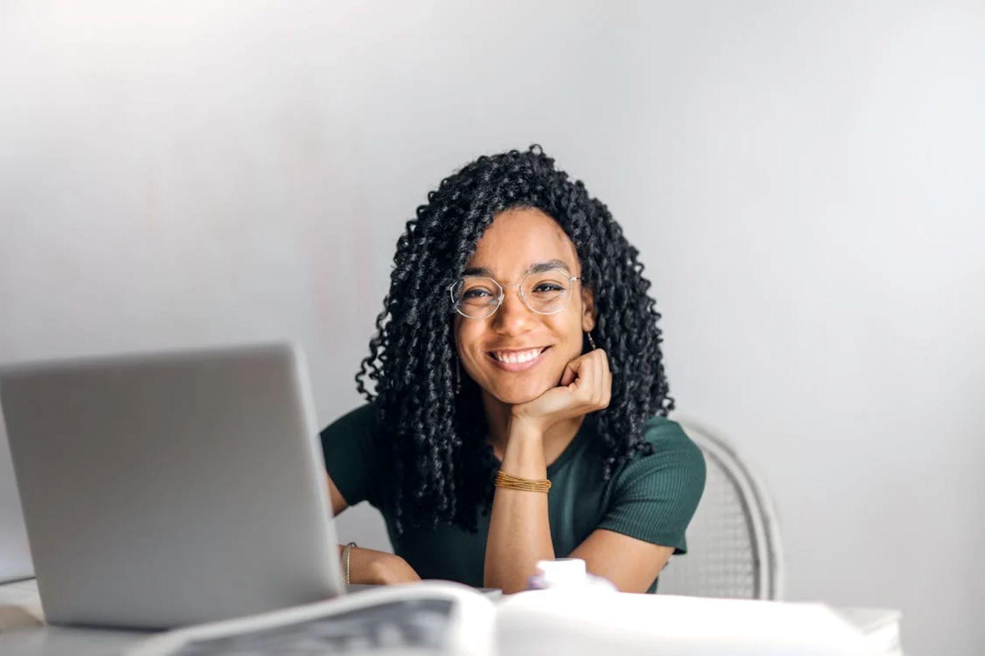 Smiling woman with laptop