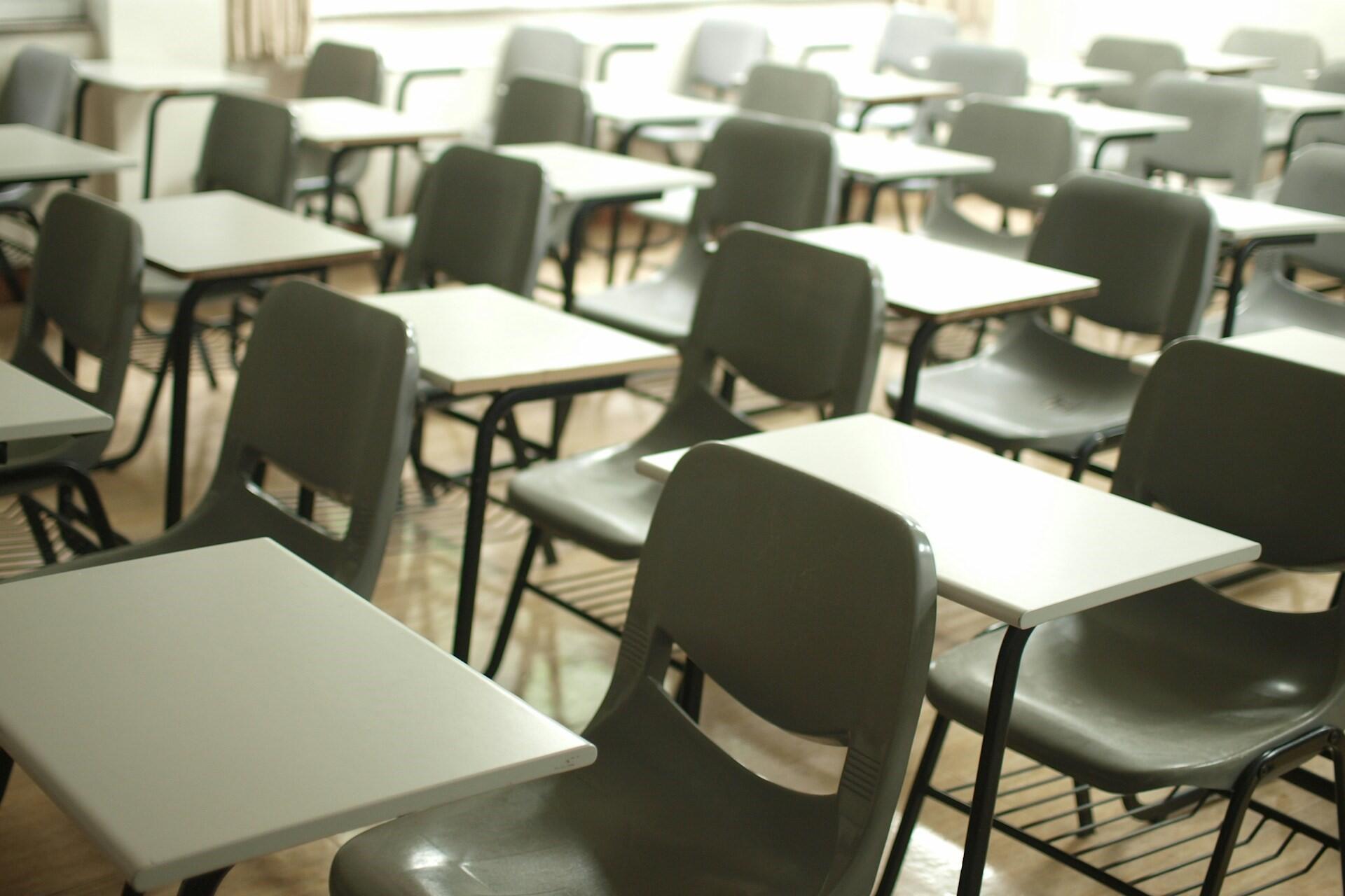 Desks and chairs in a classroom.