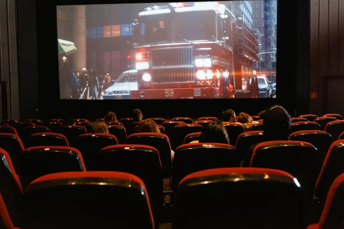 A group of people in the cinema watching a movie