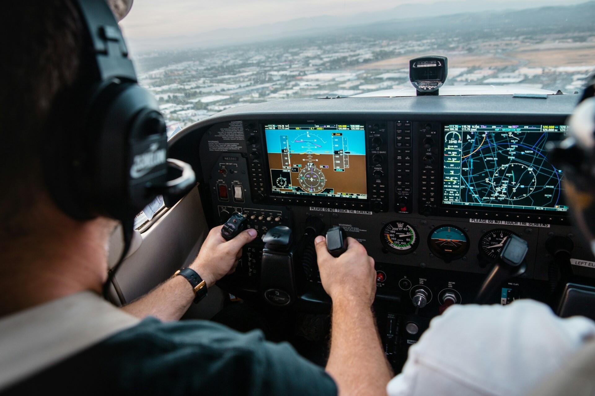 Pilots in a plane in flight.