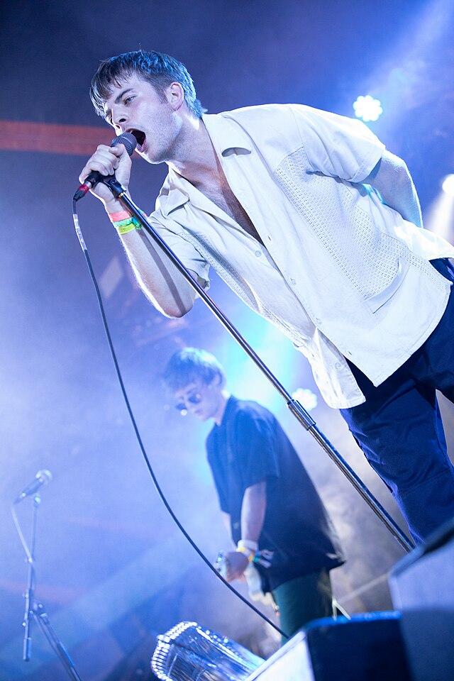 Grian Chatten performing on stage