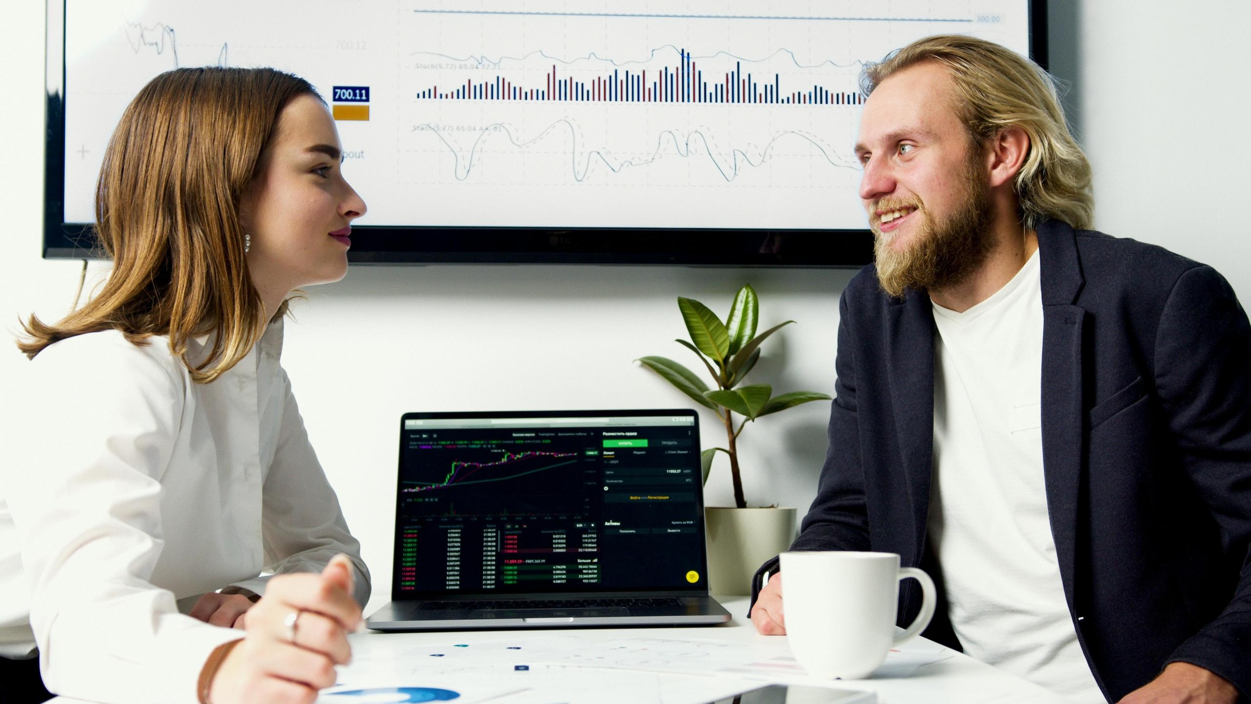 A broker talking to their client about their investments