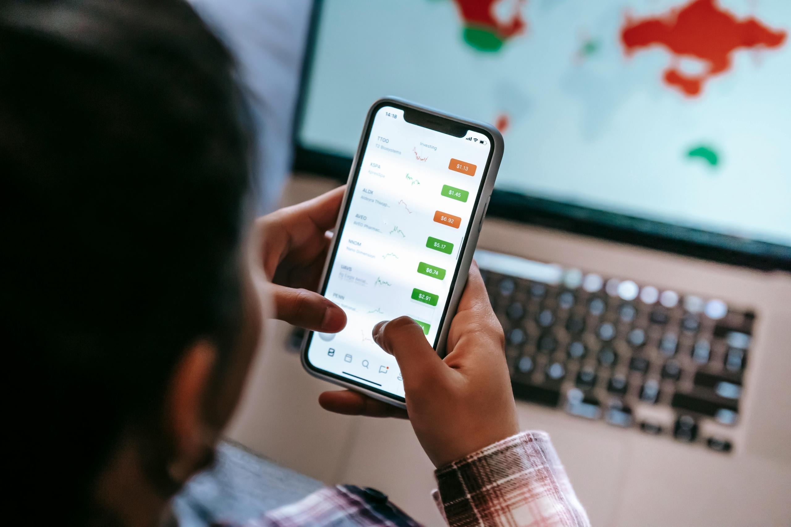 A woman managing her investments from her phone