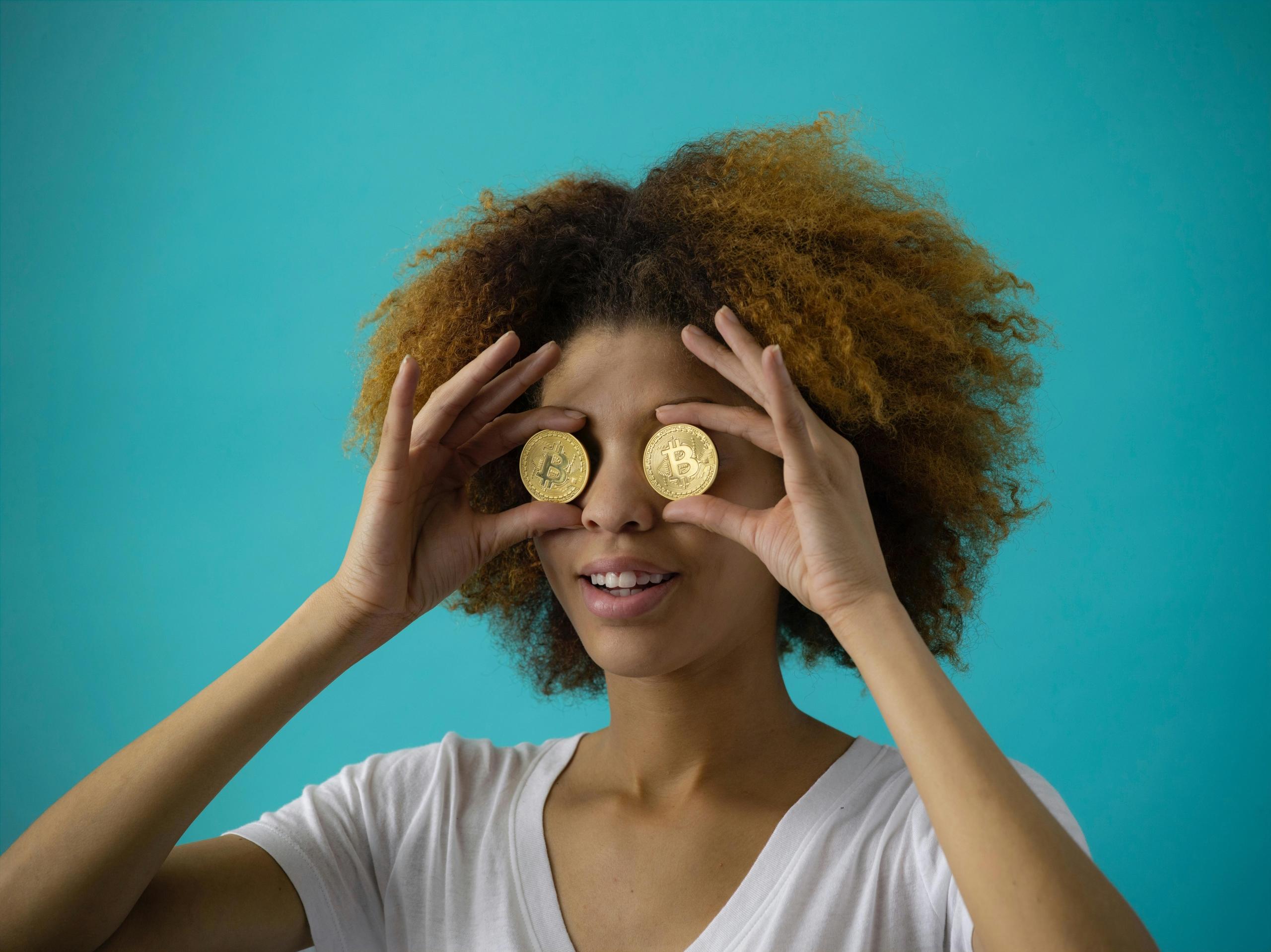 A woman looking through the lens of cryptocurrency