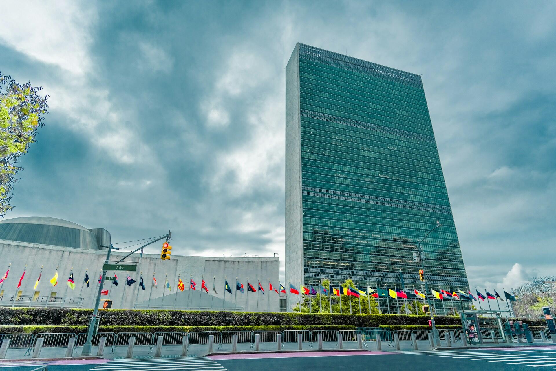 United Nations building with rows of flags outside