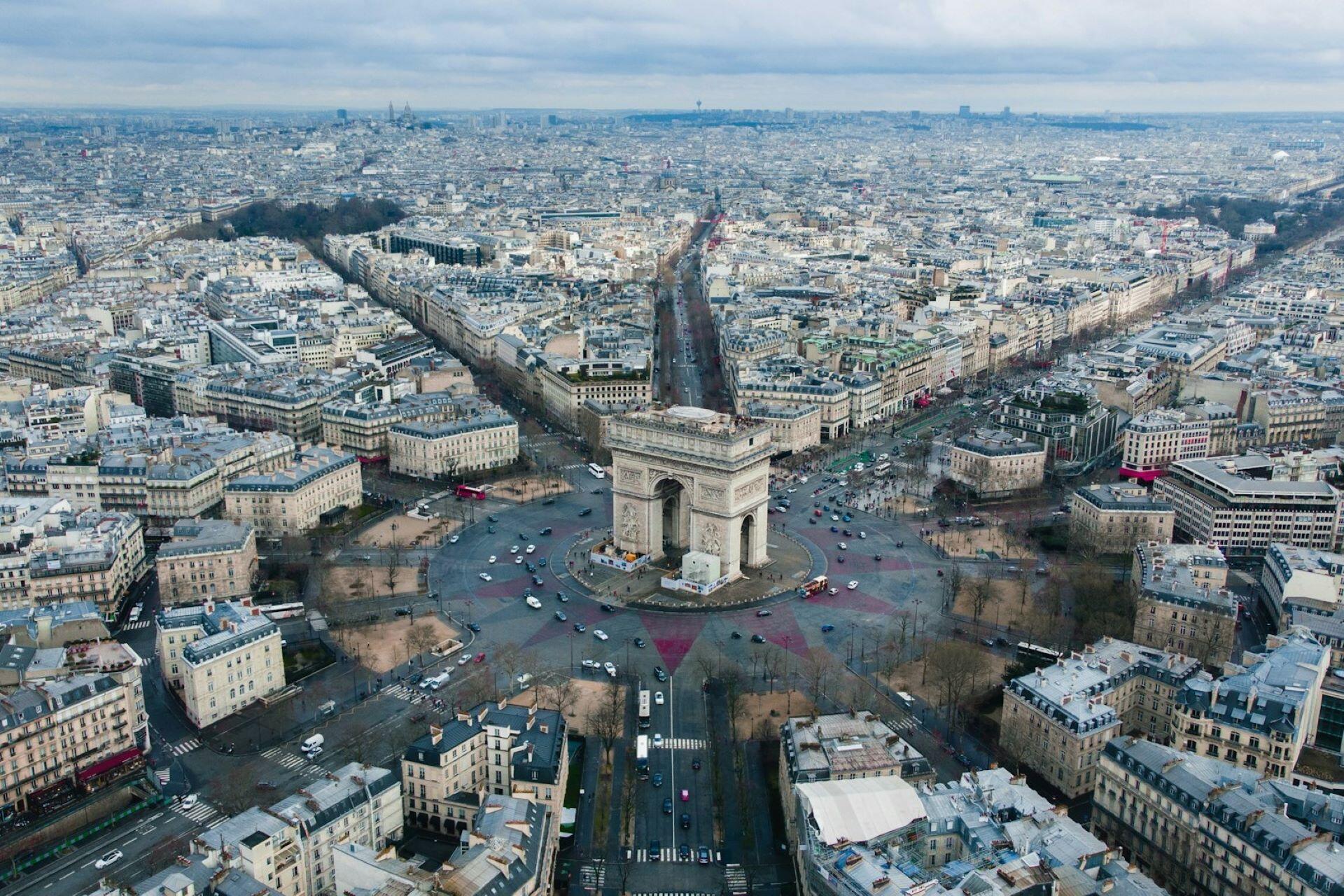 Aerial view of the Arc de Triomphe and surrounding streets in Paris