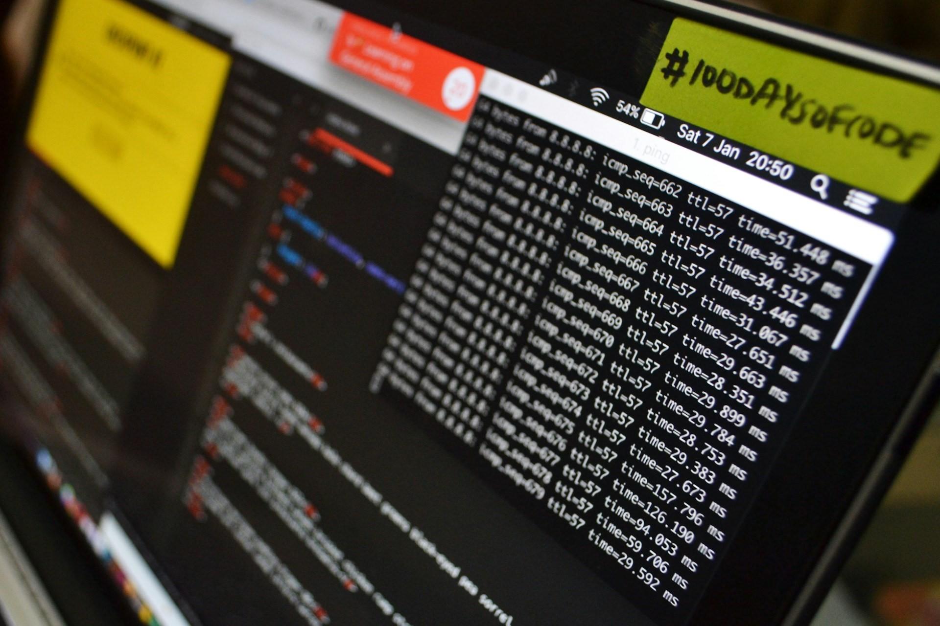 A laptop with code on it.