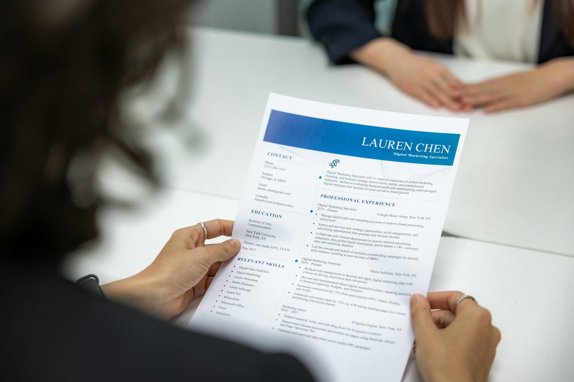 A person holding their CV.