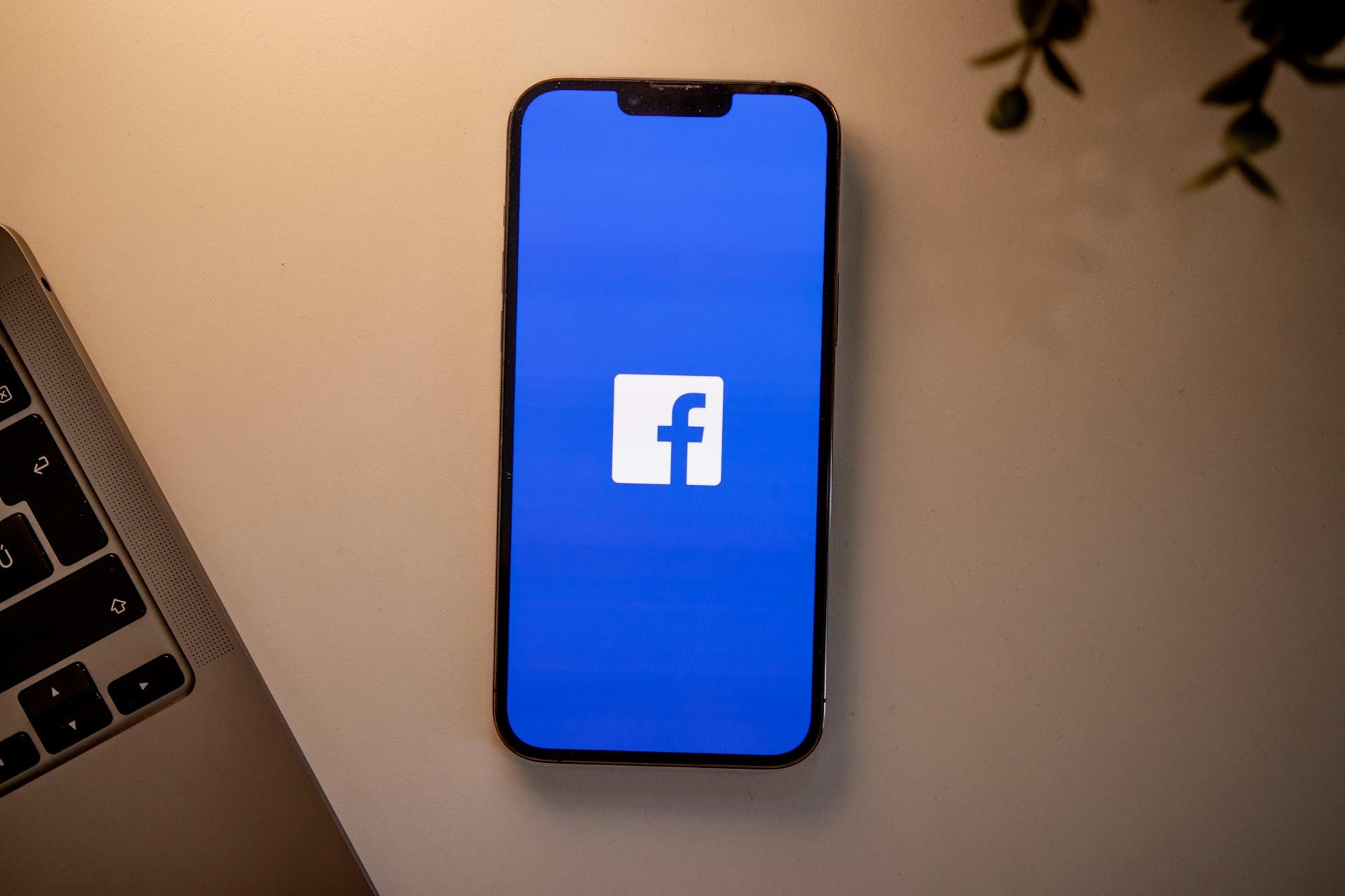 A smartphone with the Facebook icon on it.