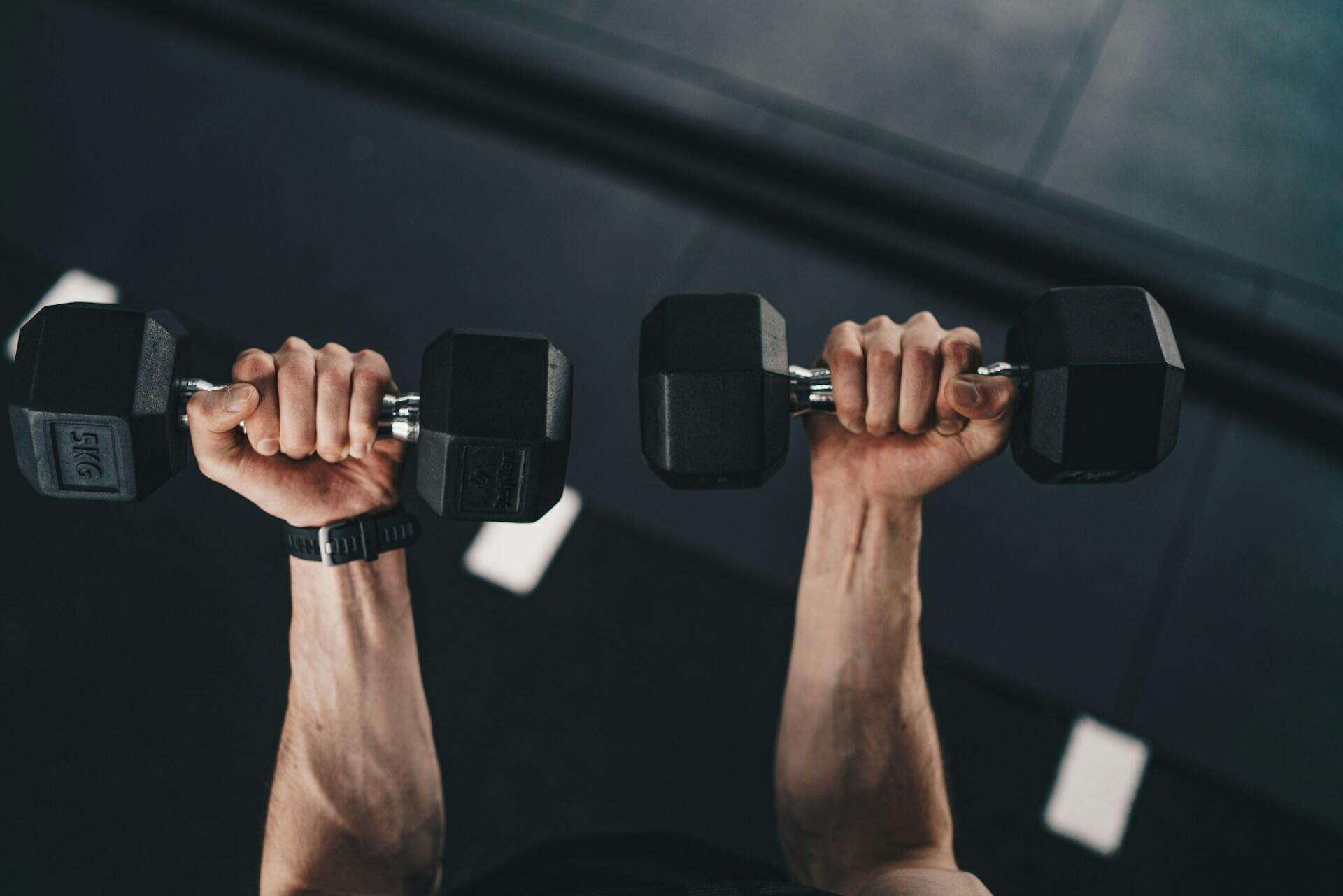 Someone lifting dumbbells.