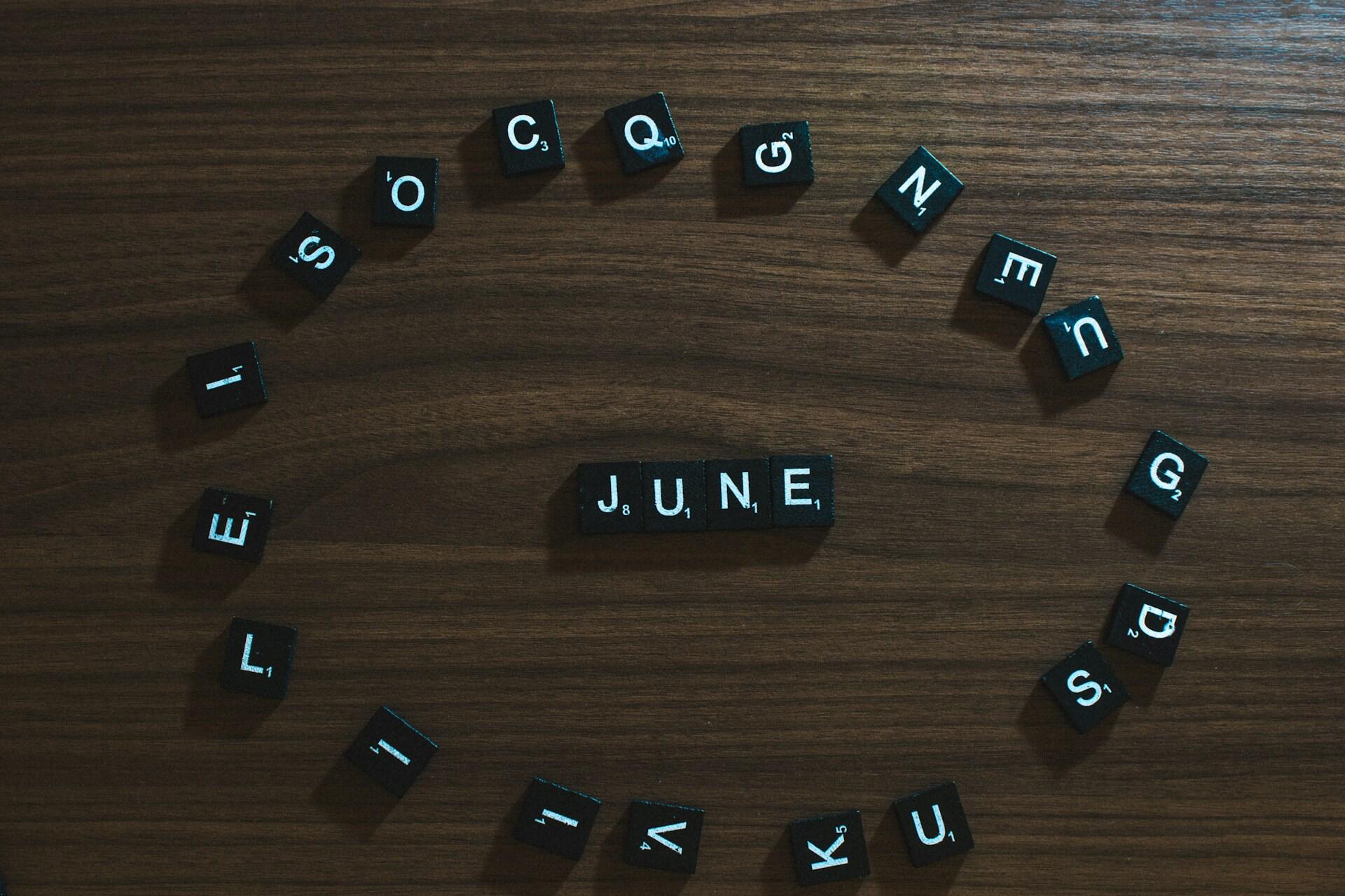 Letter tiles arranged in a circle with the word June in the centre