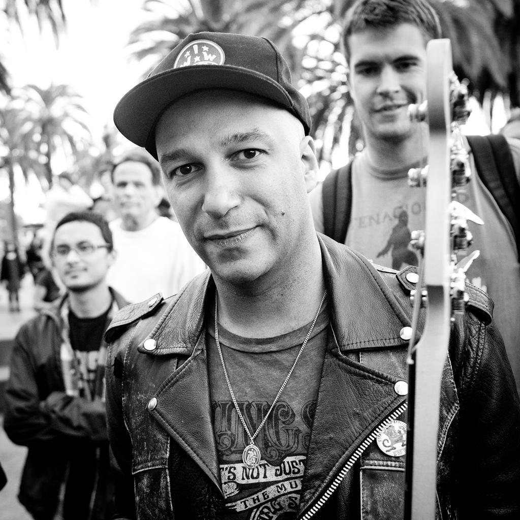 Tom Morello, holding a guitar Image via Visual Hunt.