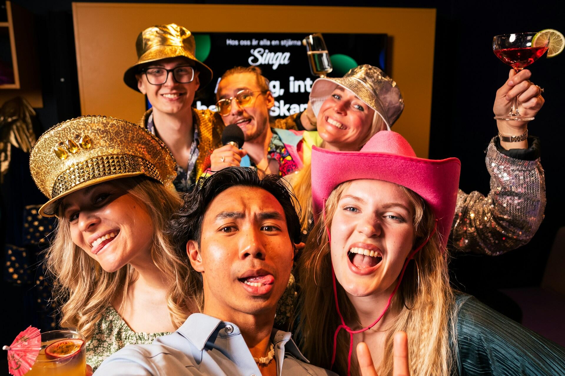 A group of friends in a karaoke booth.