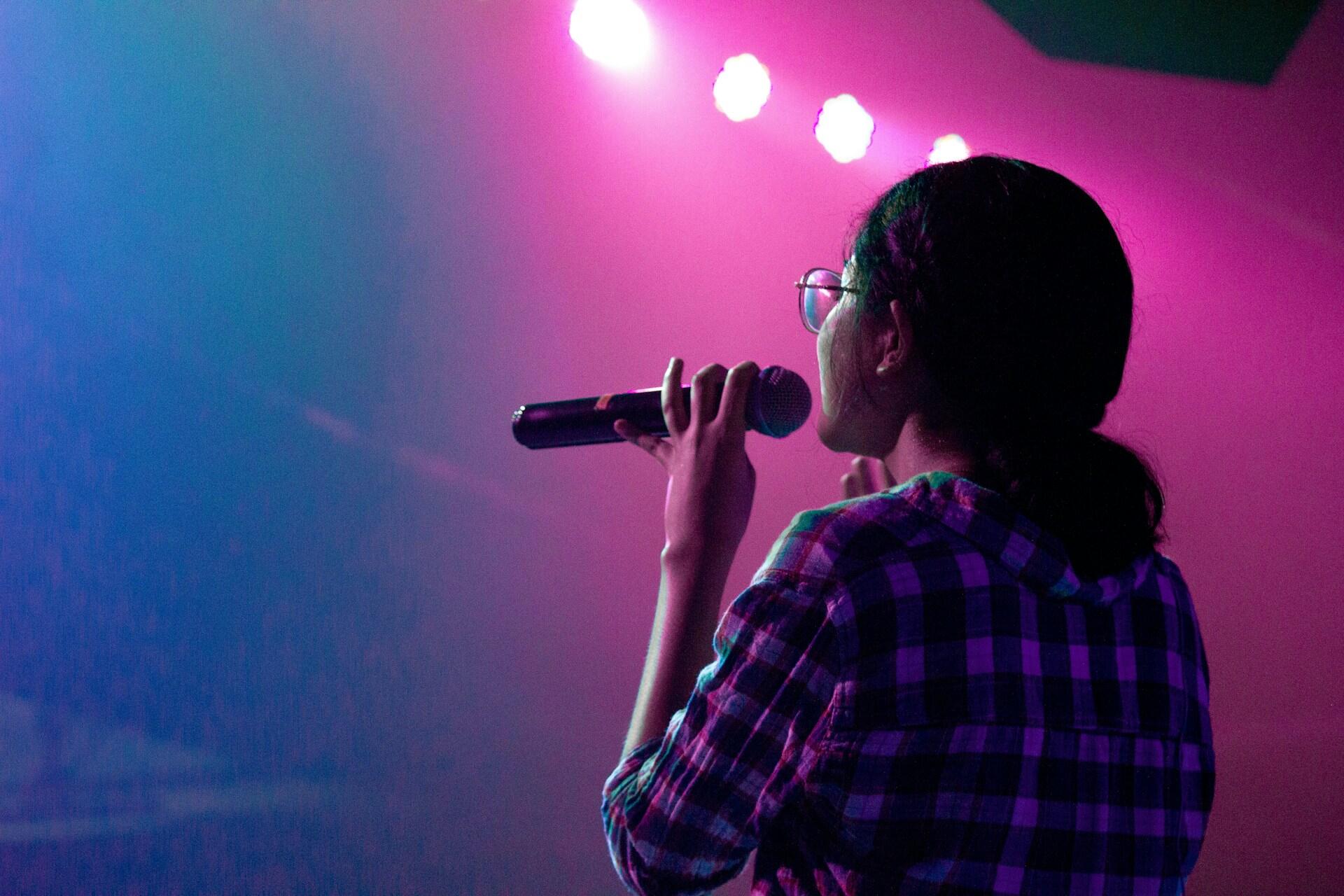 A girl singing karaoke.