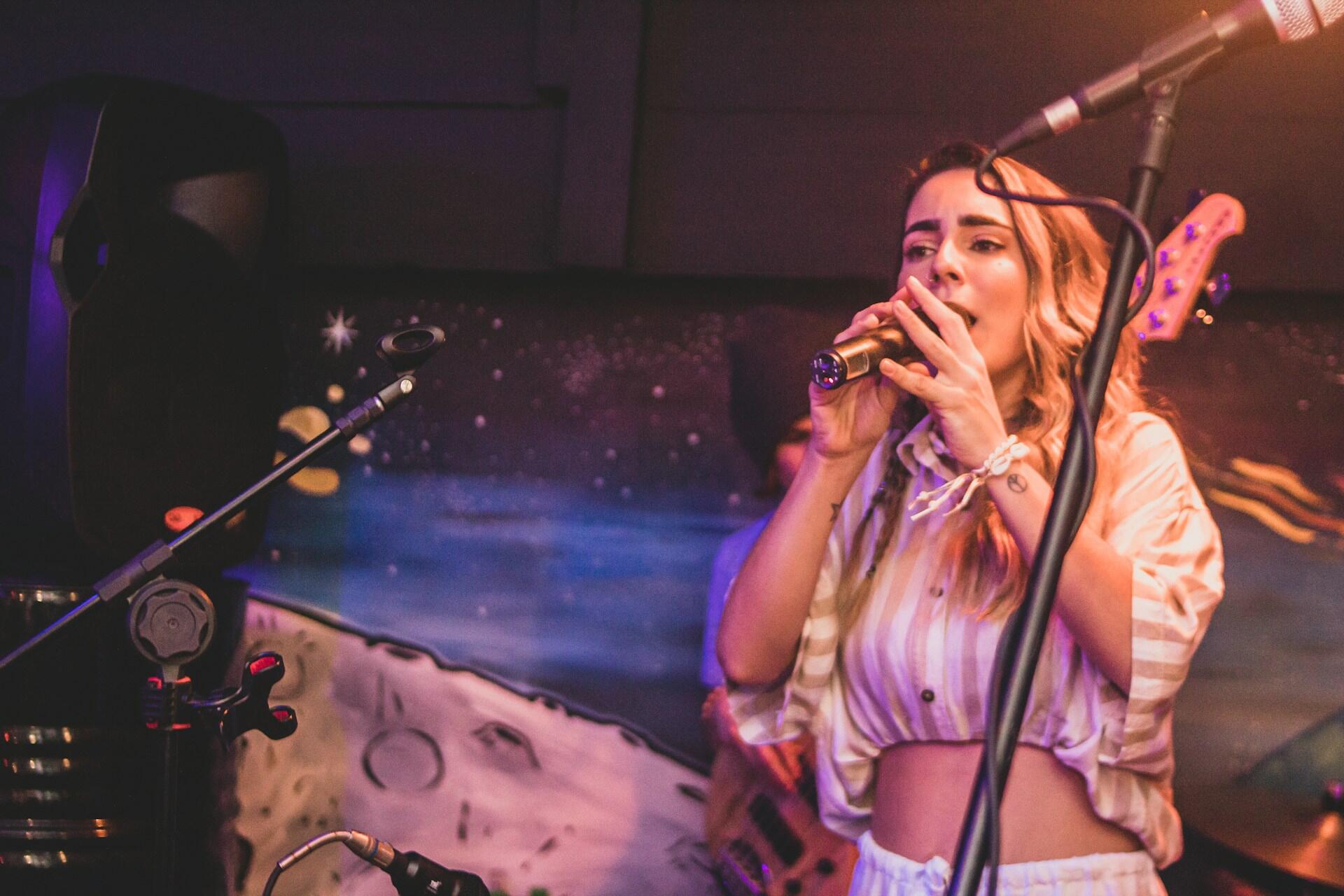 A singer on stage doing karaoke.