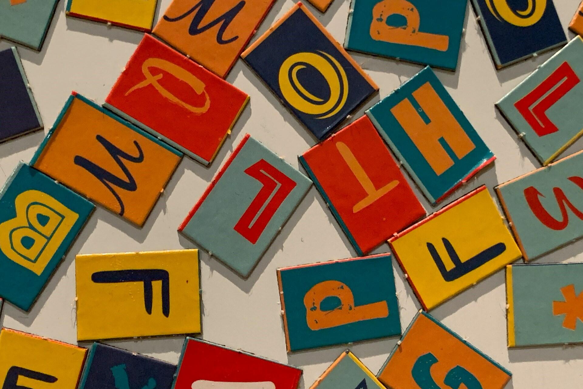 Jigsaw pieces with letters on them.