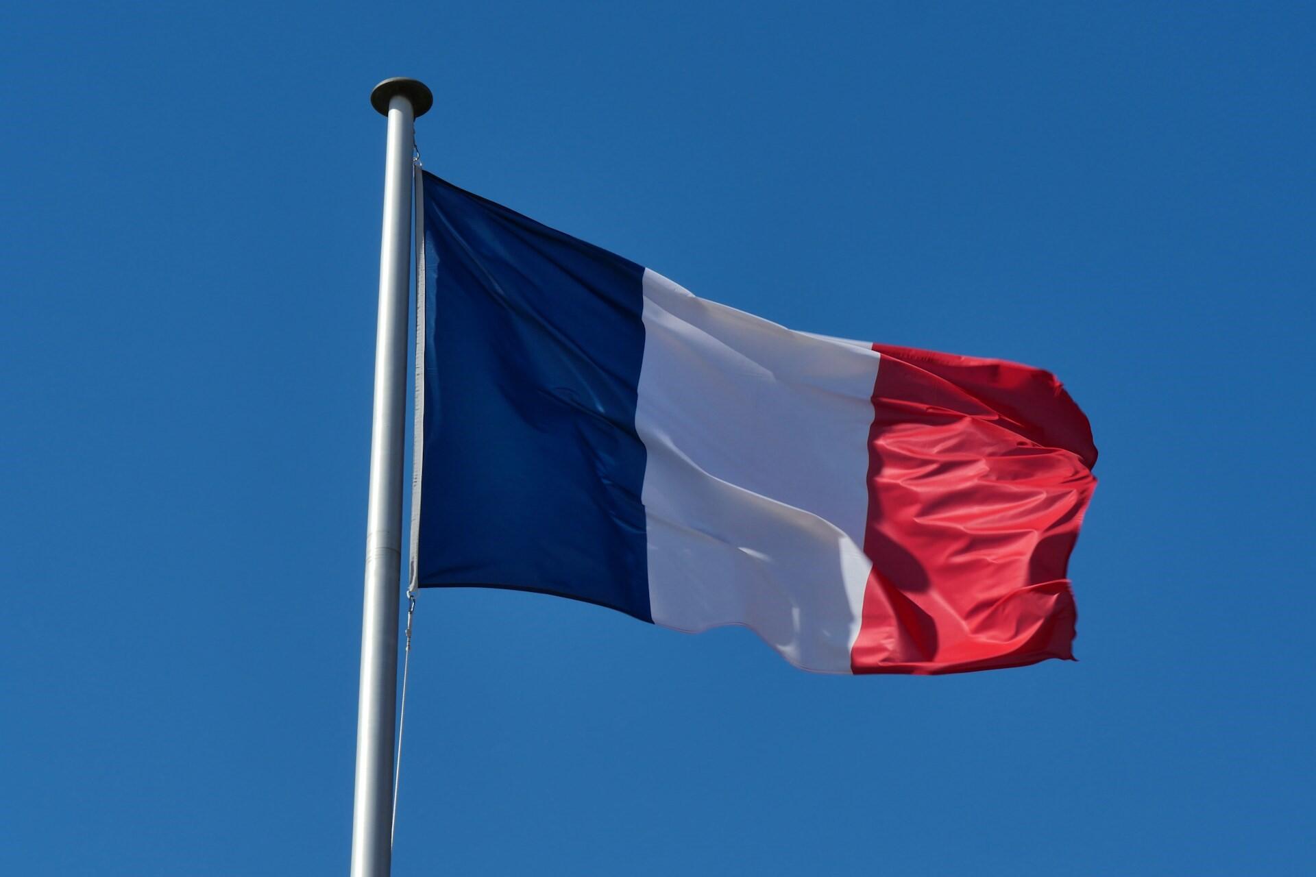 The French flag flying in the wind.
