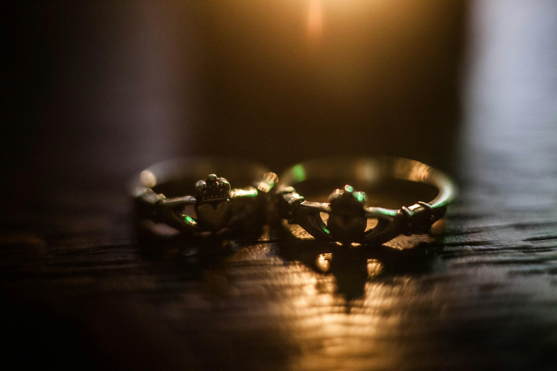 Close-up of Claddagh rings on a wooden surface
