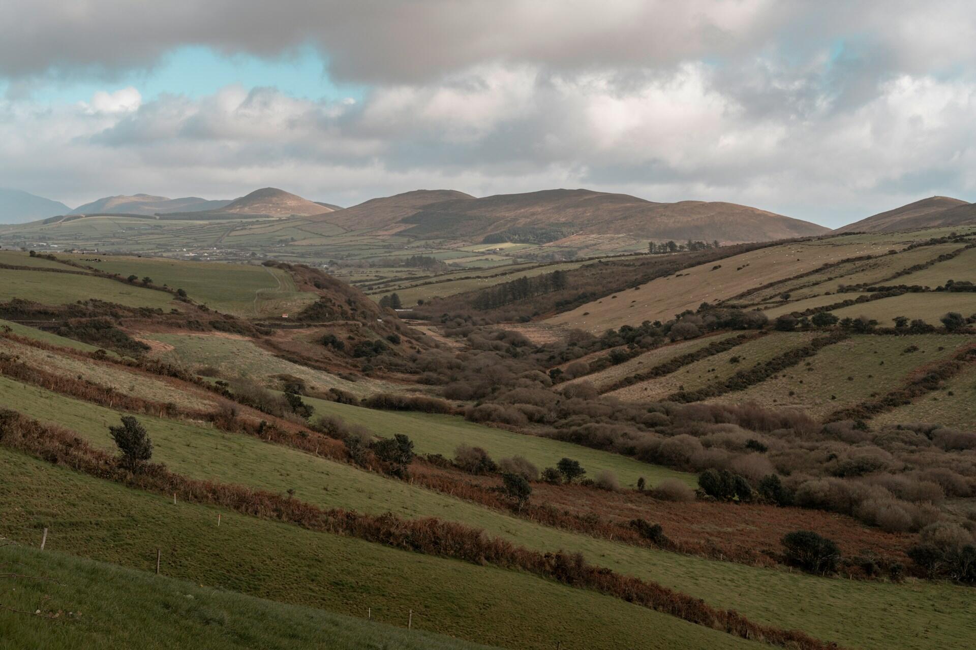 rolling green hills and valley landscape in countryside