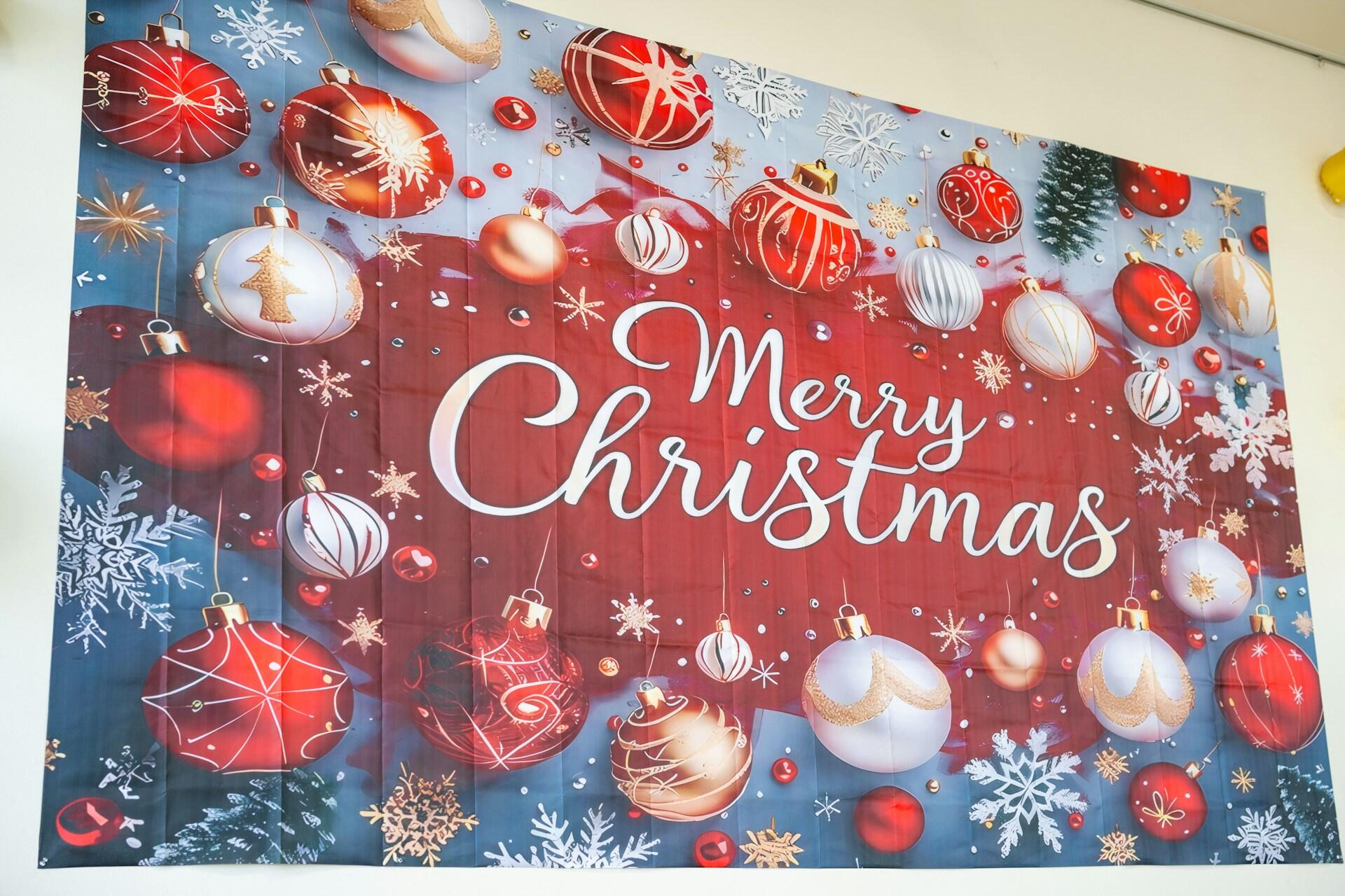 red and white Merry Christmas banner with ornaments and snowflakes