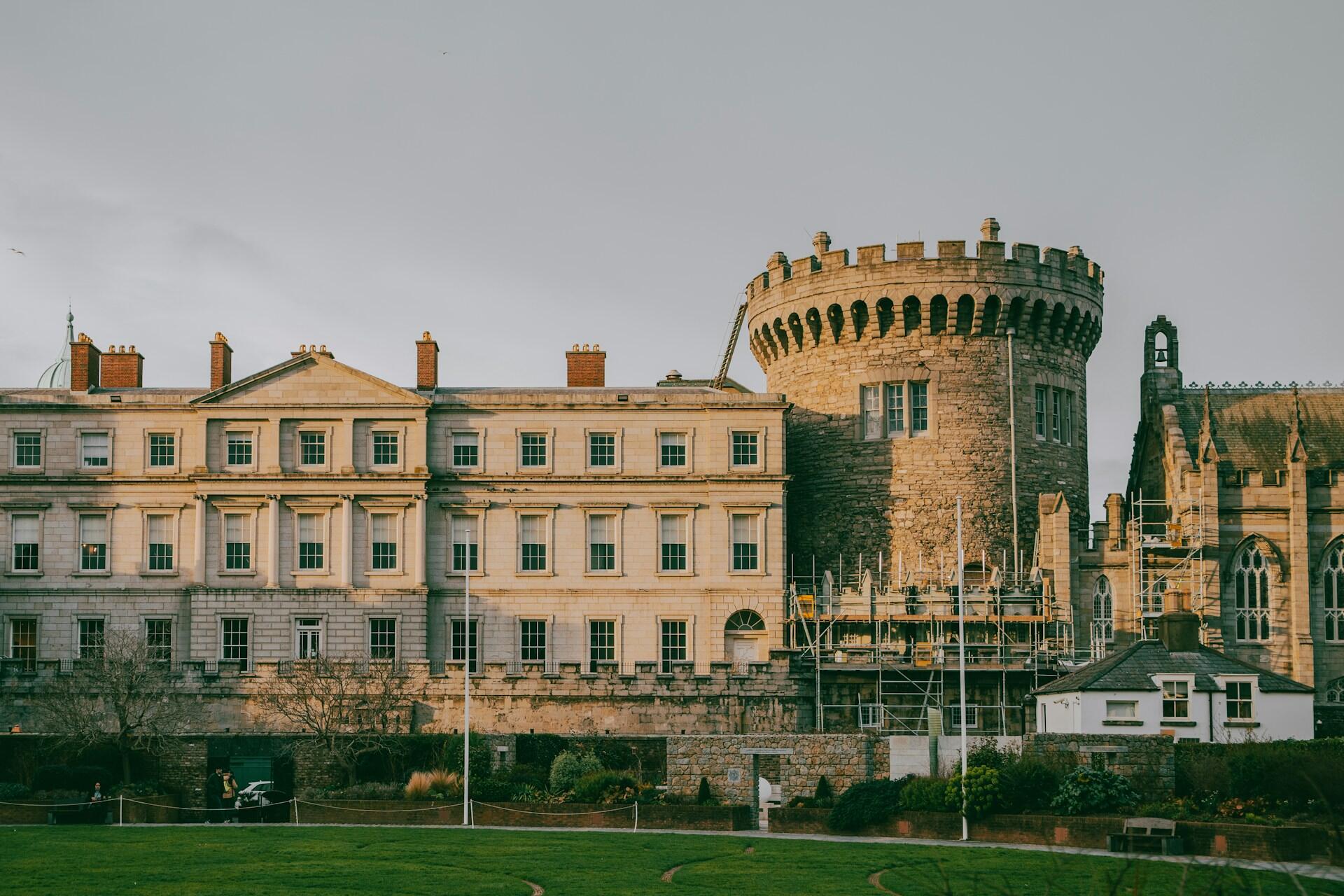 Stone tower and historic buildings at Dublin Castle complex in central Dublin
