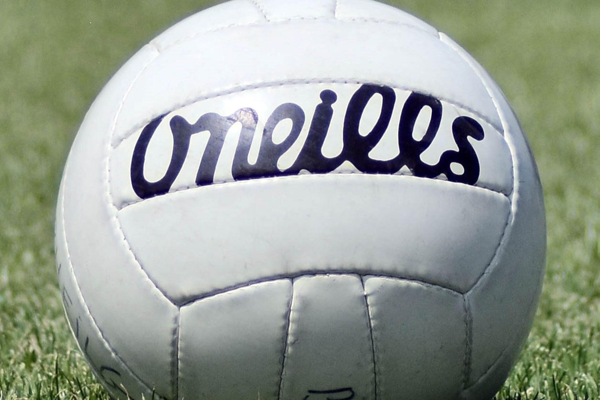 Close-up of a white O’Neills Gaelic football on grass
