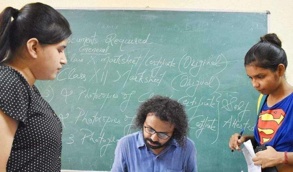 Teacher checking work of a student