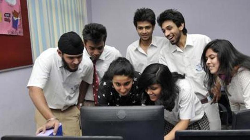 Students learning something on computer.